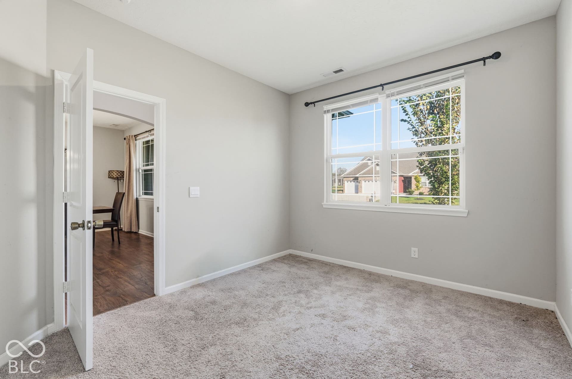 Downstairs bedroom with big window.