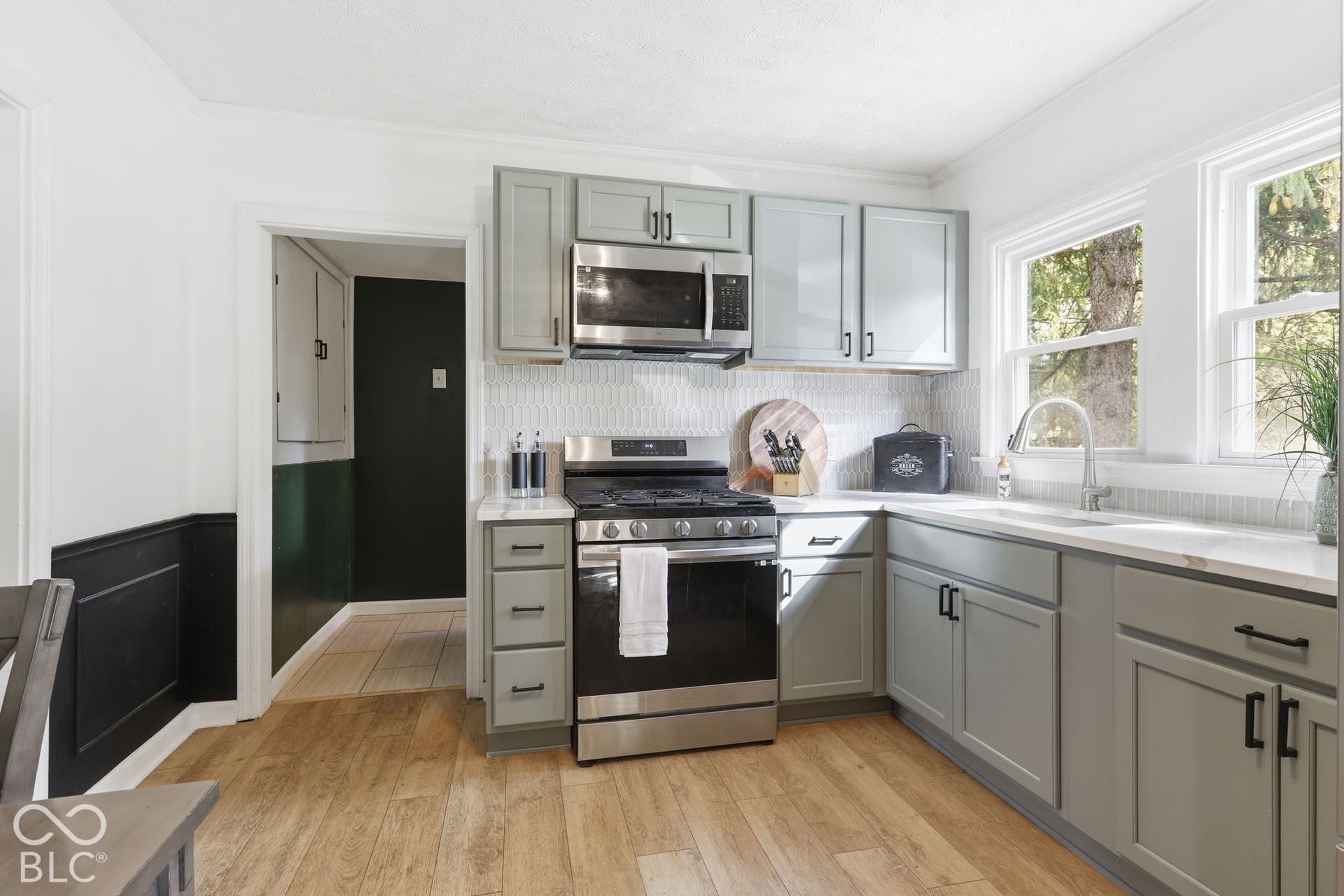 Fully Updated Brand New Kitchen with Stainless Steel appliances, more great flooring and updated lighting.