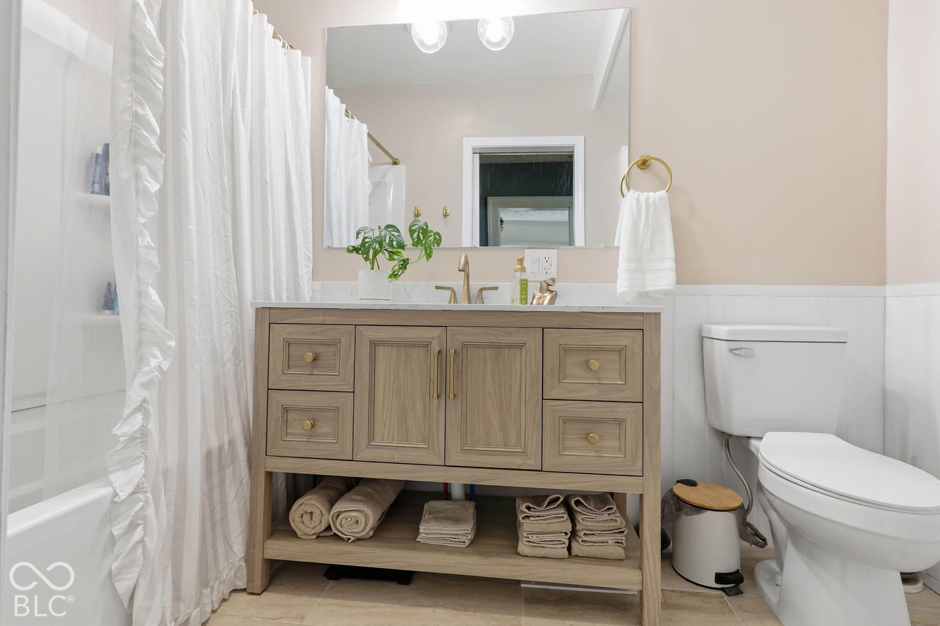 Fully Updated Main Floor Full Bath with Full Shower/Bath combo, Awesome Vanity and tile flooring.