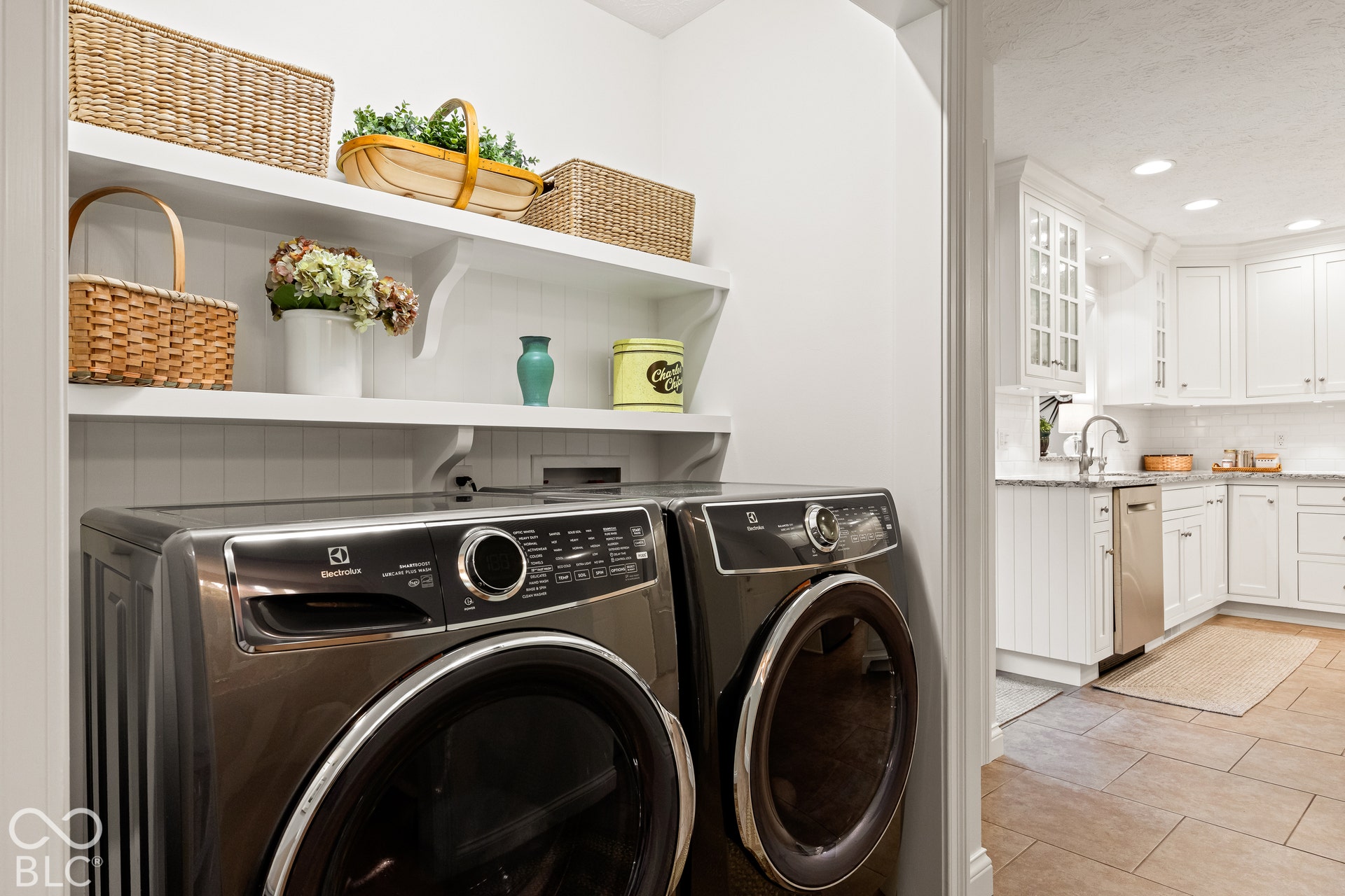 Built-in shelving with decorative corbel supports and a beadboard backsplash