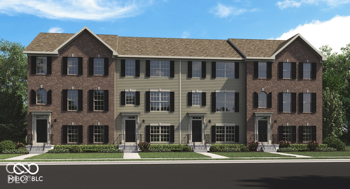 Multi-unit building exterior featuring a mix of brick and horizontal siding, decorative shutters, gabled rooflines, and arched window details