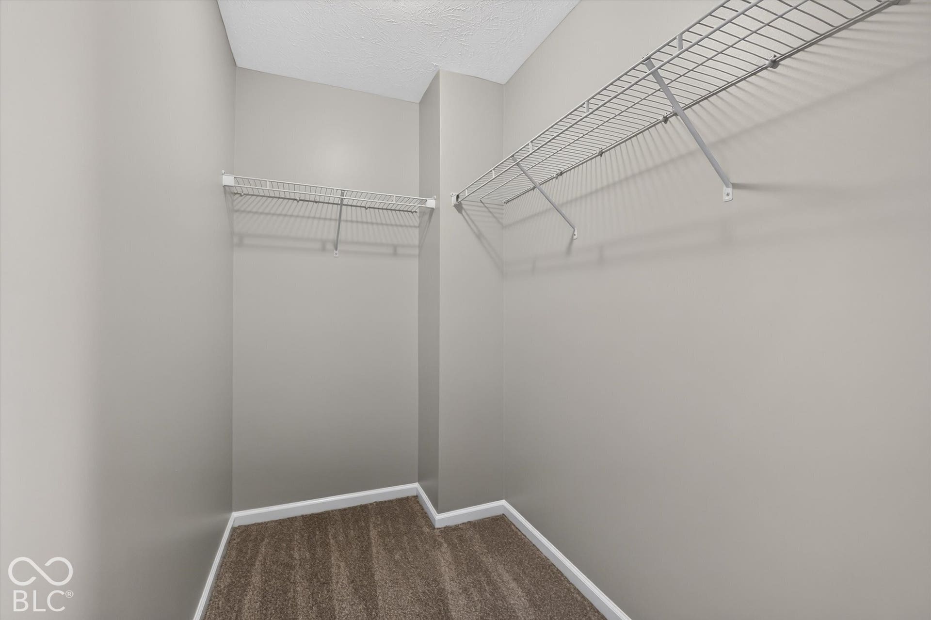 View of walk-in closet for primary bedroom