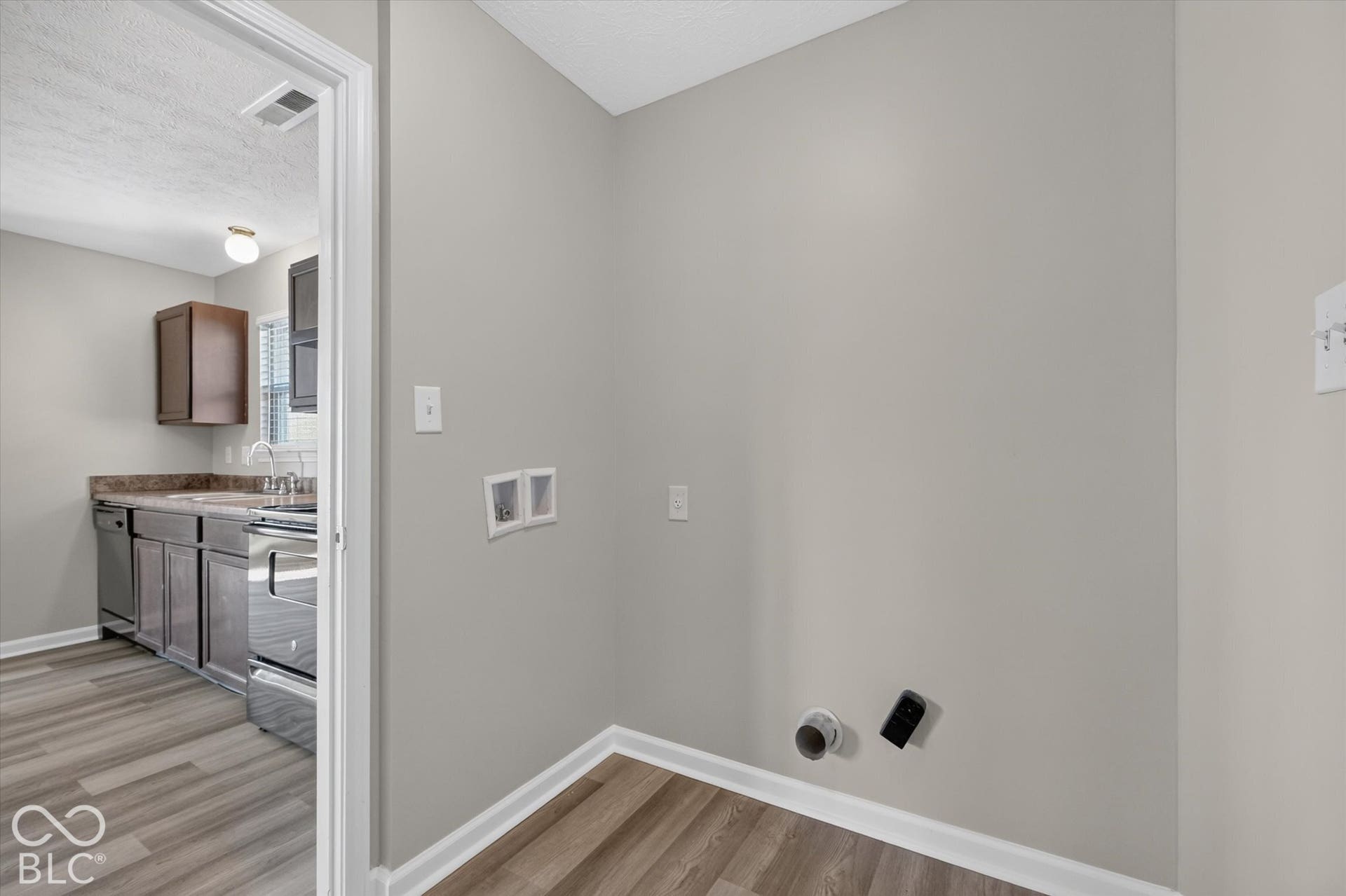 Dedicated laundry room with new LVP flooring