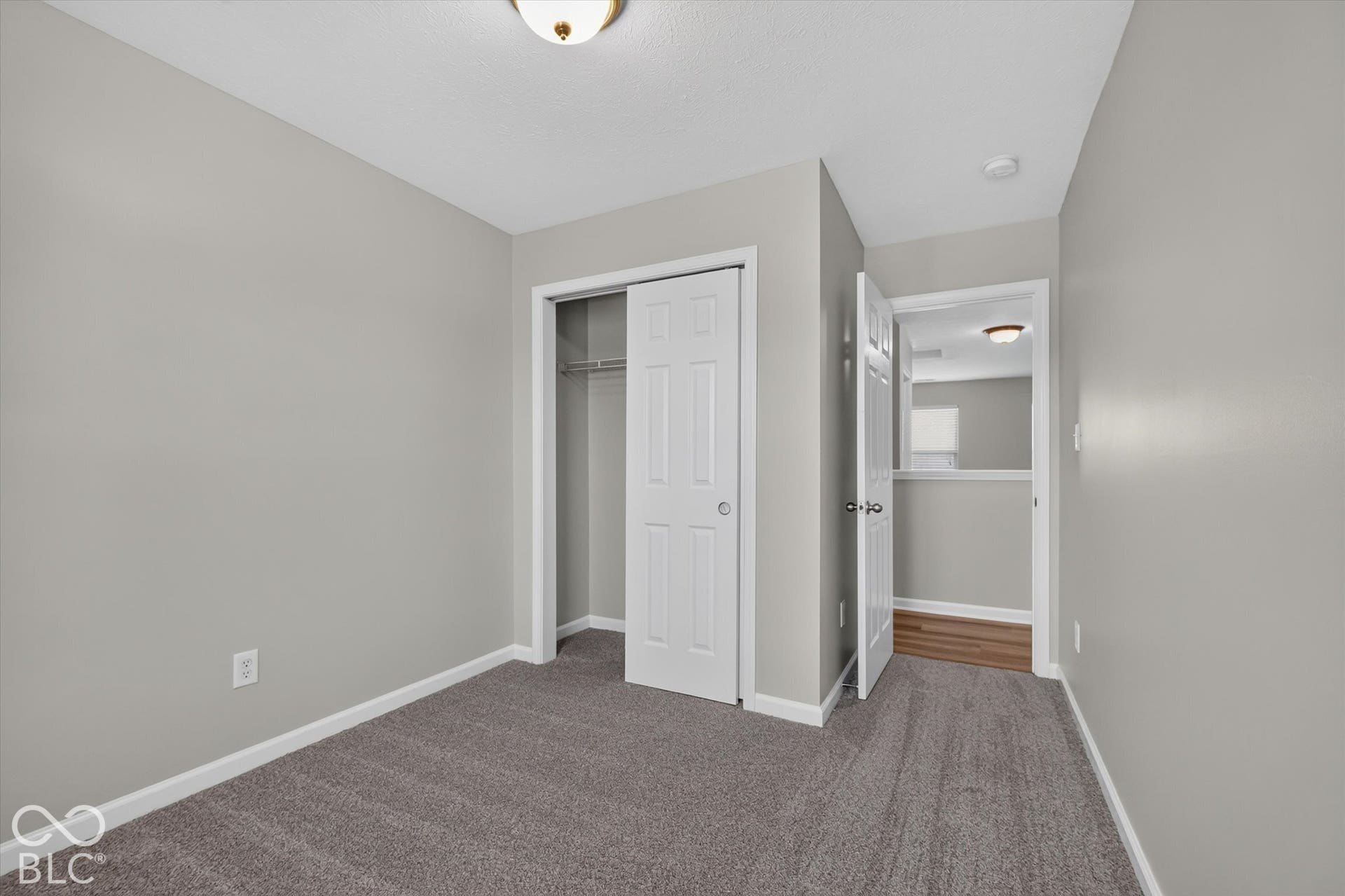 3rd bedroom with new carpet and neutral wall color