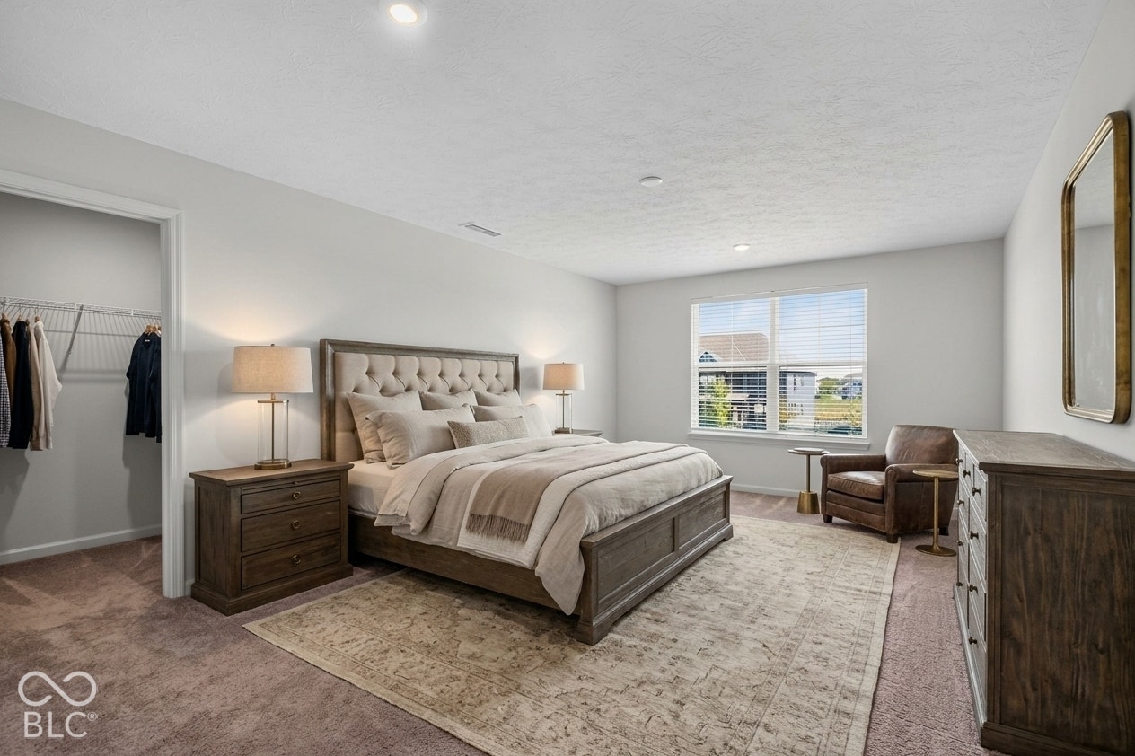 Virtually Altered - Neutral-toned walls, recessed lighting, carpeted flooring, and a window with natural light