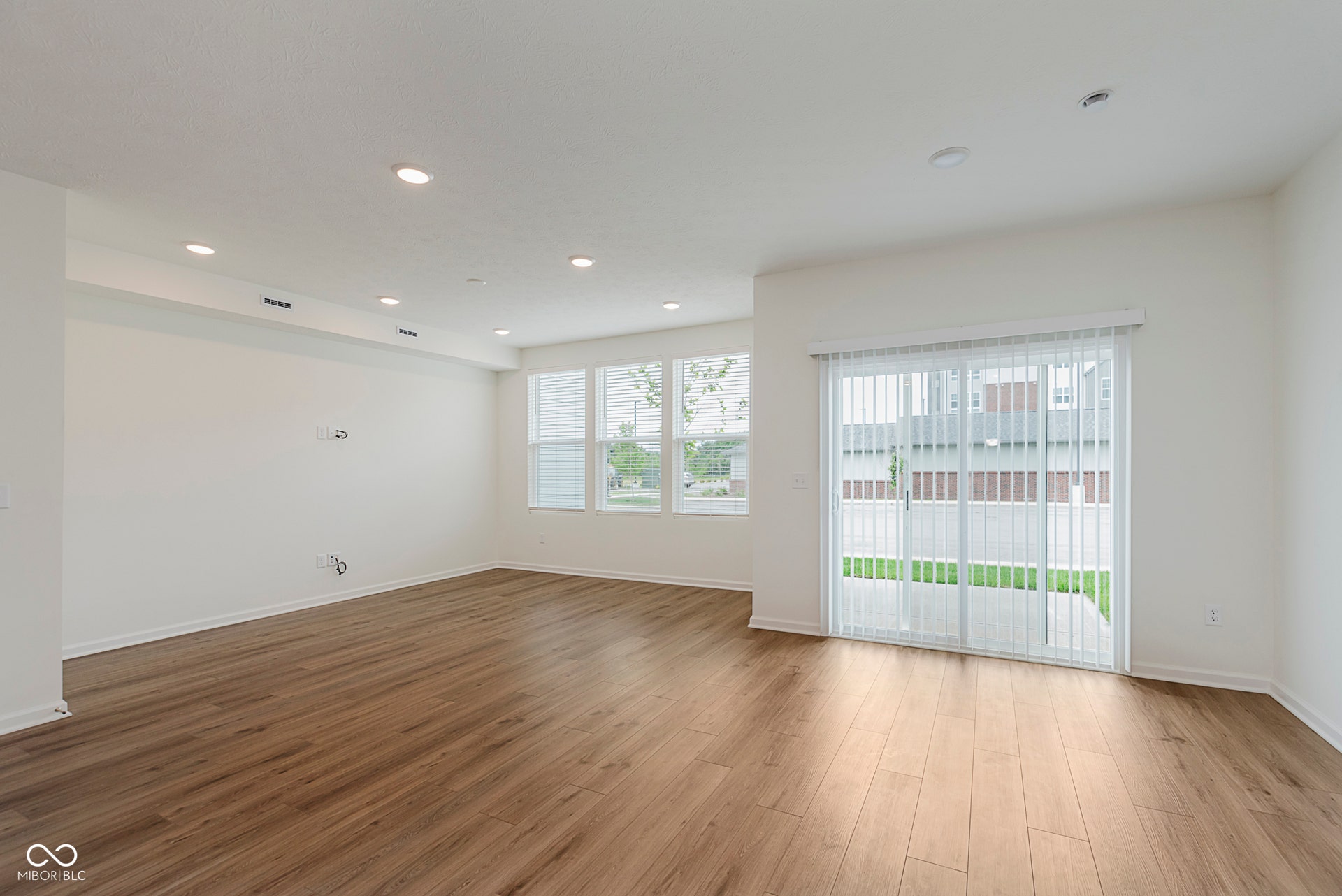 spare room with recessed lighting and wood finished floors