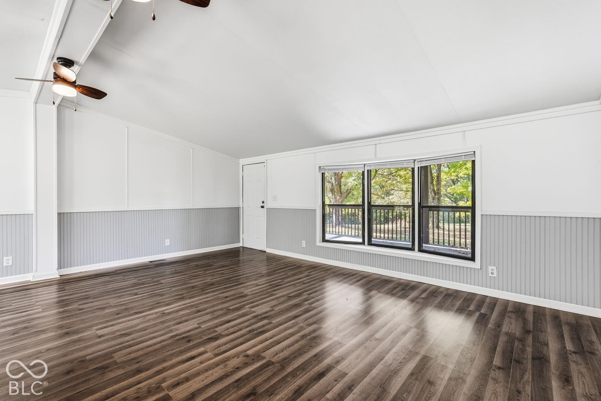 Vaulted ceilings, wood-finish flooring, beadboard wainscoting, and triple-pane windows