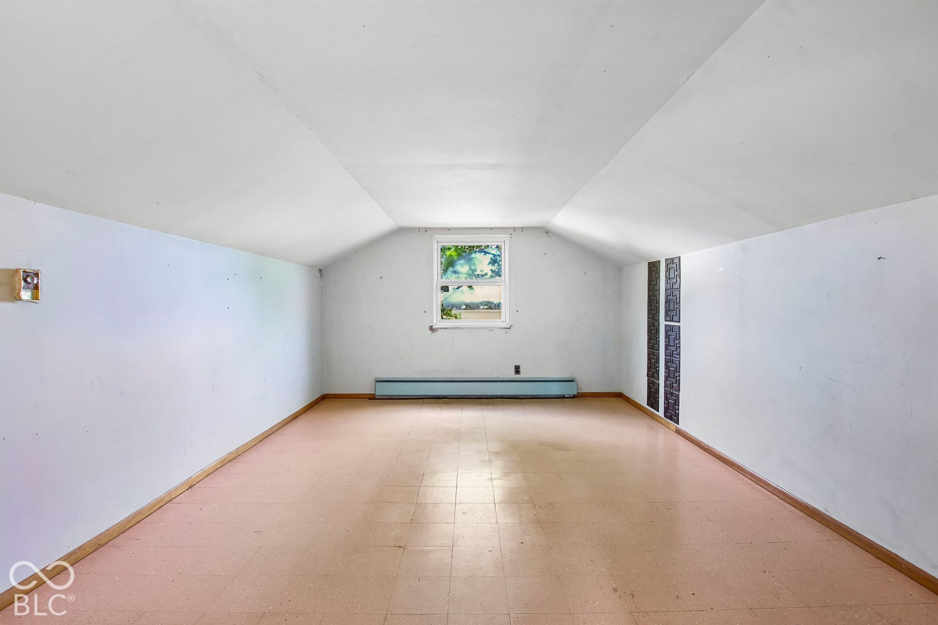 4469 E 400 S, Franklin, IN 46131 Finished room featuring vaulted ceilings and a single window with exterior scenery