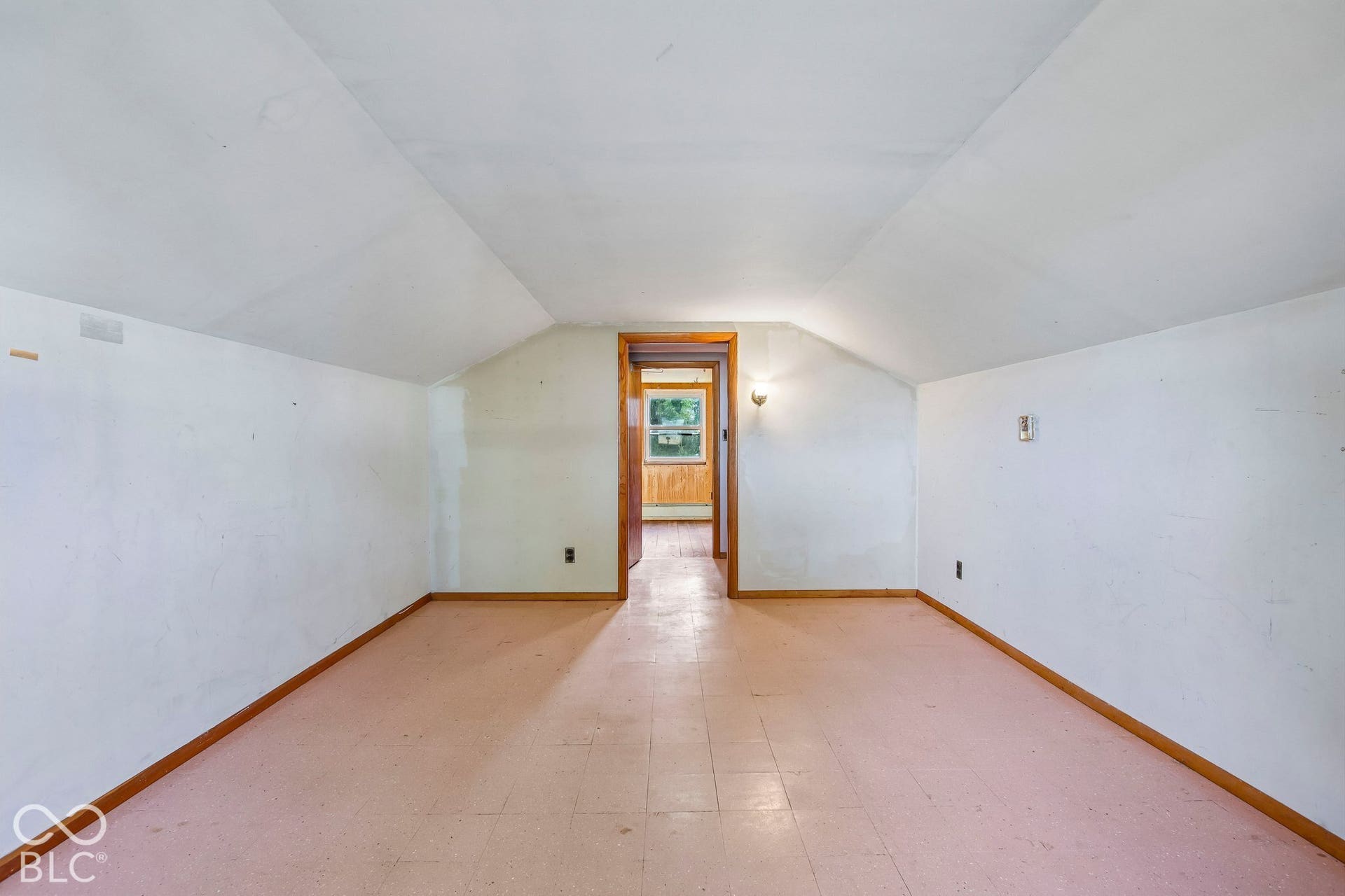 4469 E 400 S, Franklin, IN 46131 Finished space featuring vaulted ceilings, tile flooring, and a wooden door frame