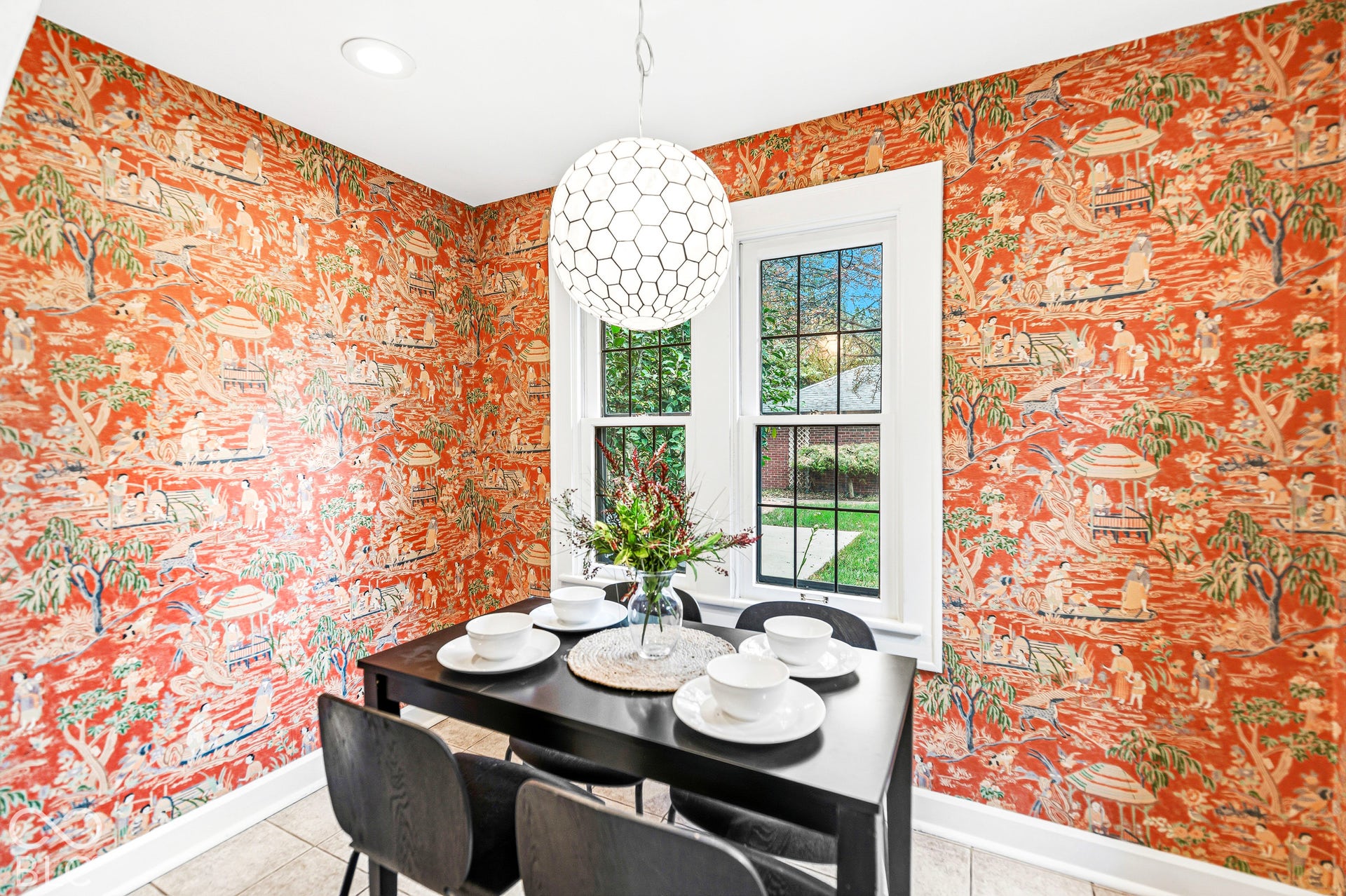 Patterned wallpaper, dual windows with white trim, ceramic tile flooring, and a contemporary geometric pendant light fixture