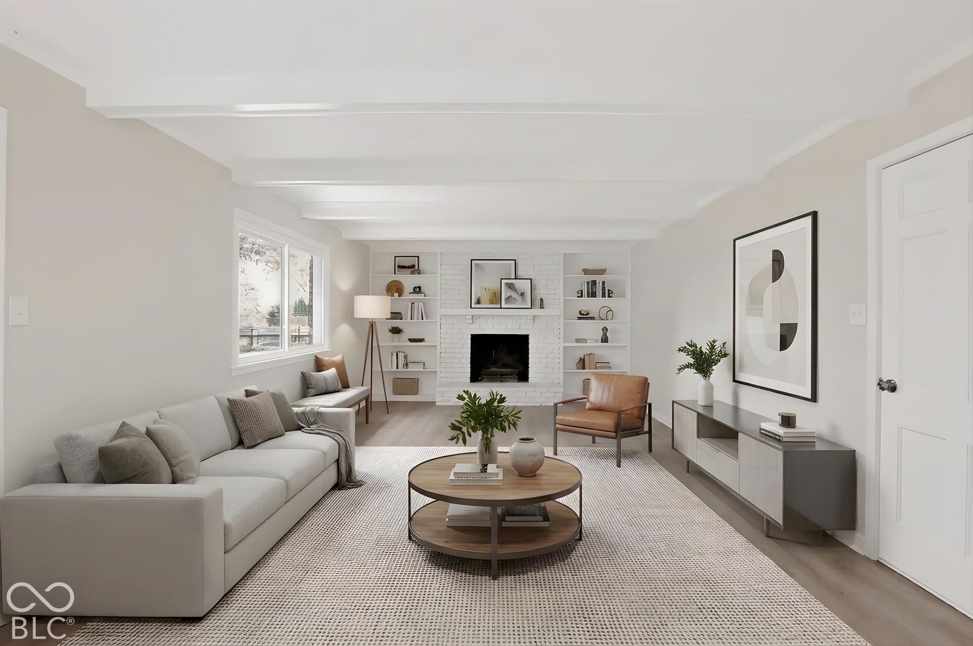 Virtually Altered - Living area featuring a white brick fireplace, built-in shelving, wood-finish flooring, and exposed ceiling beams