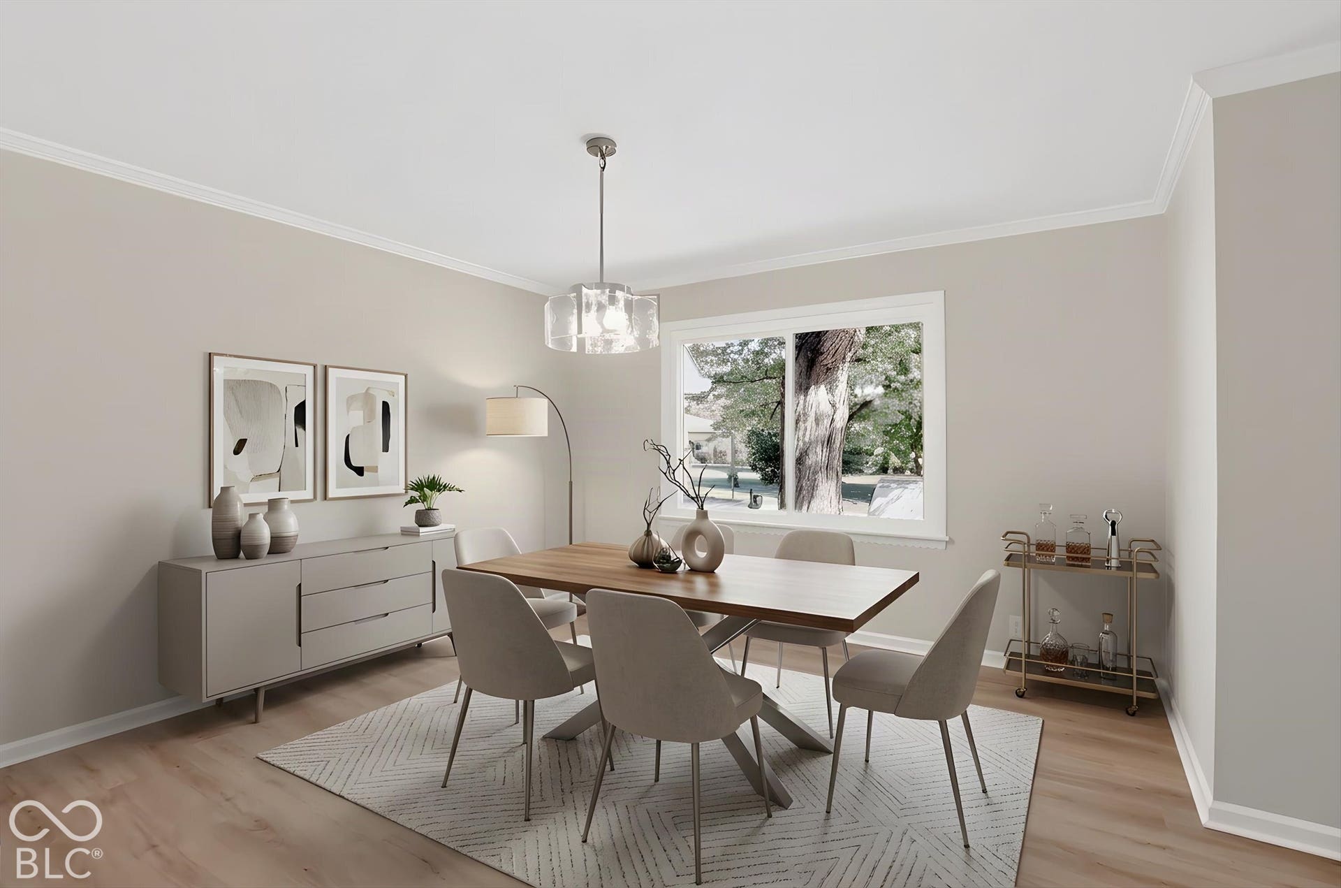 Virtually Altered - Dining area featuring light-toned wood-finish flooring, neutral wall paint, a large horizontal window, and a drum-style pendant light fixture