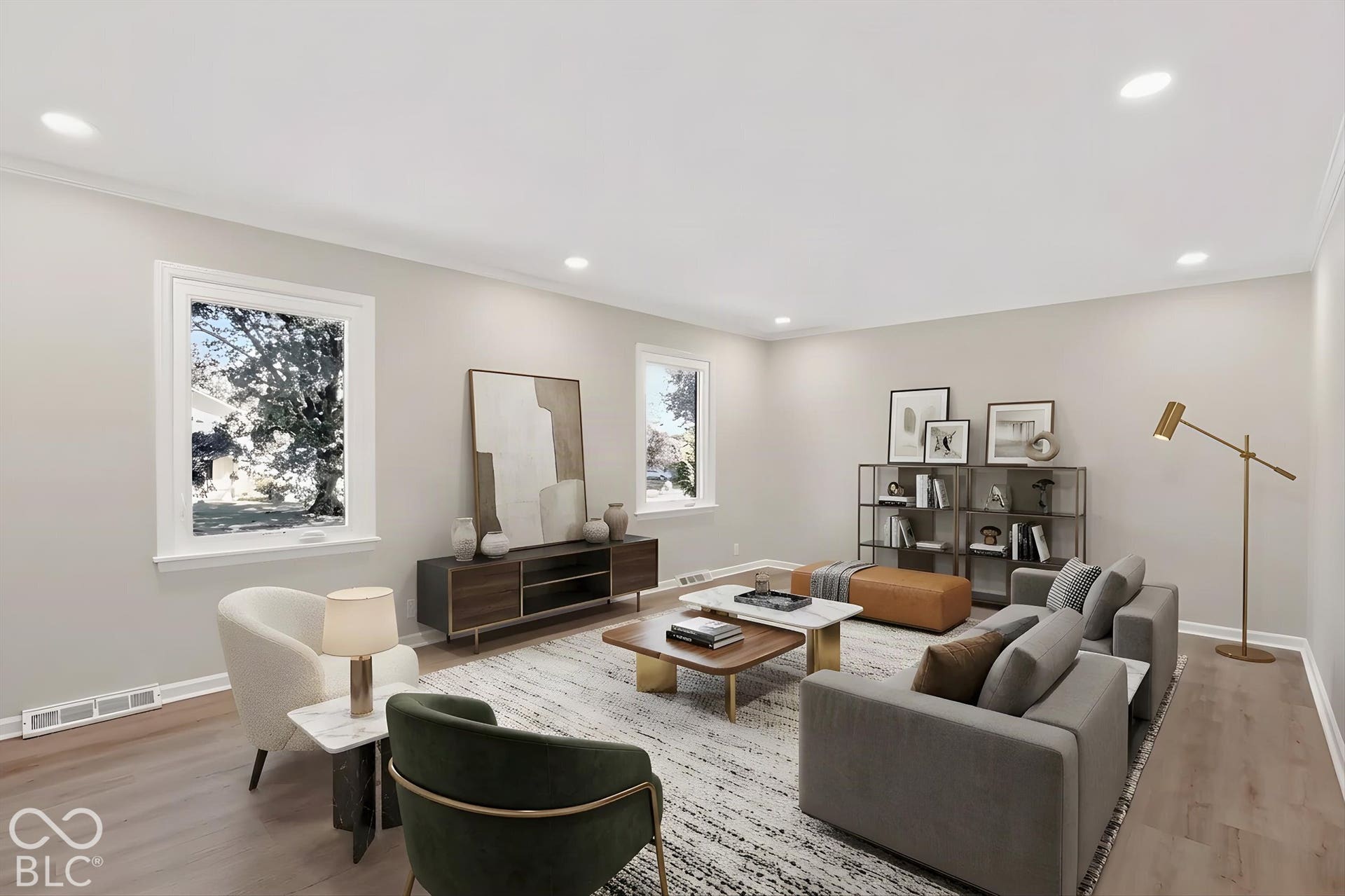 Virtually Altered - Neutral-toned living space featuring wood-finish flooring, recessed lighting, and expansive windows
