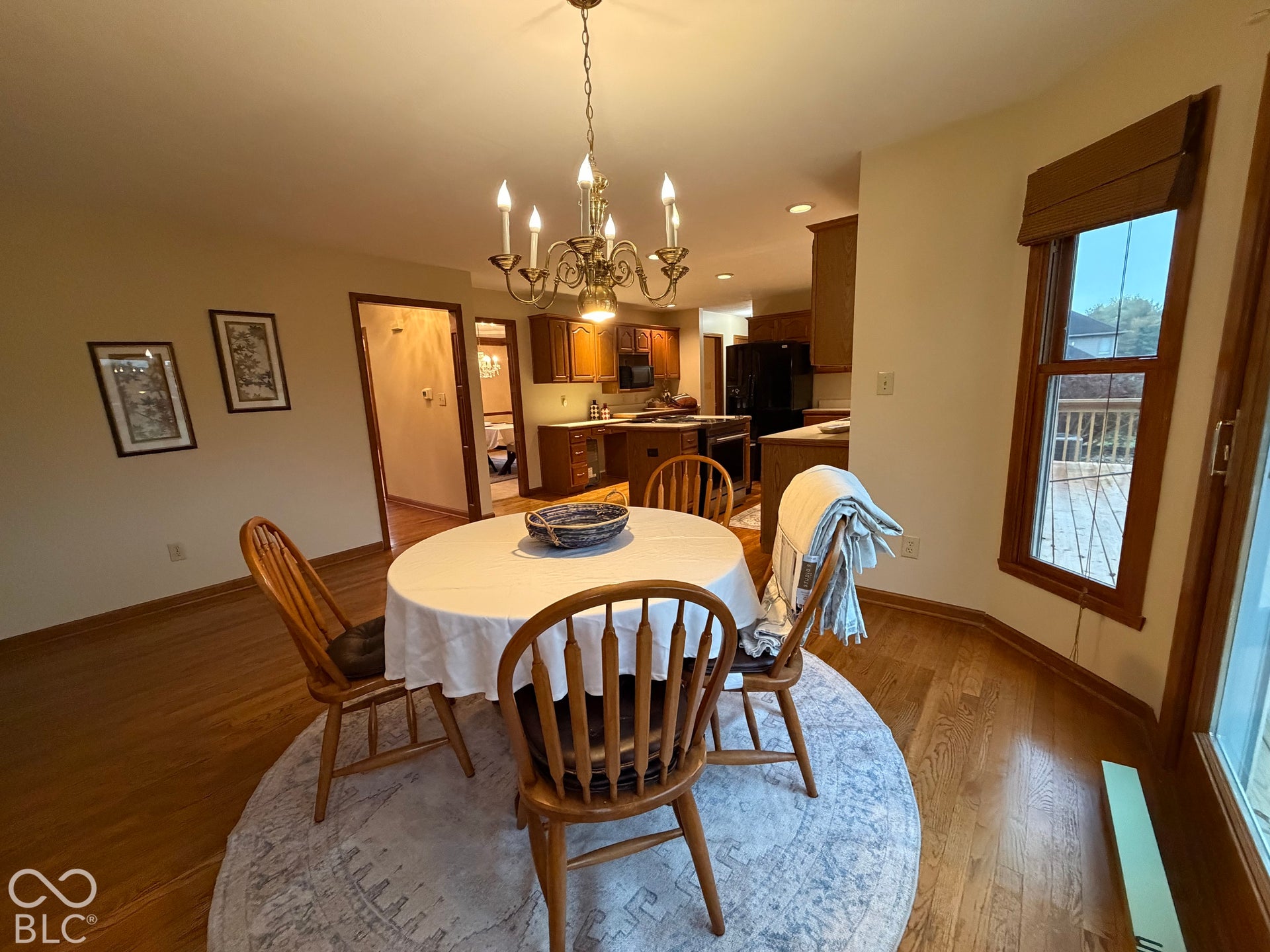 Spacious nook will accommodate a table for 10 or more plus china cabinet. Leads to brand new deck where you will enjoy Indiana's gorgeous fall sunsets.