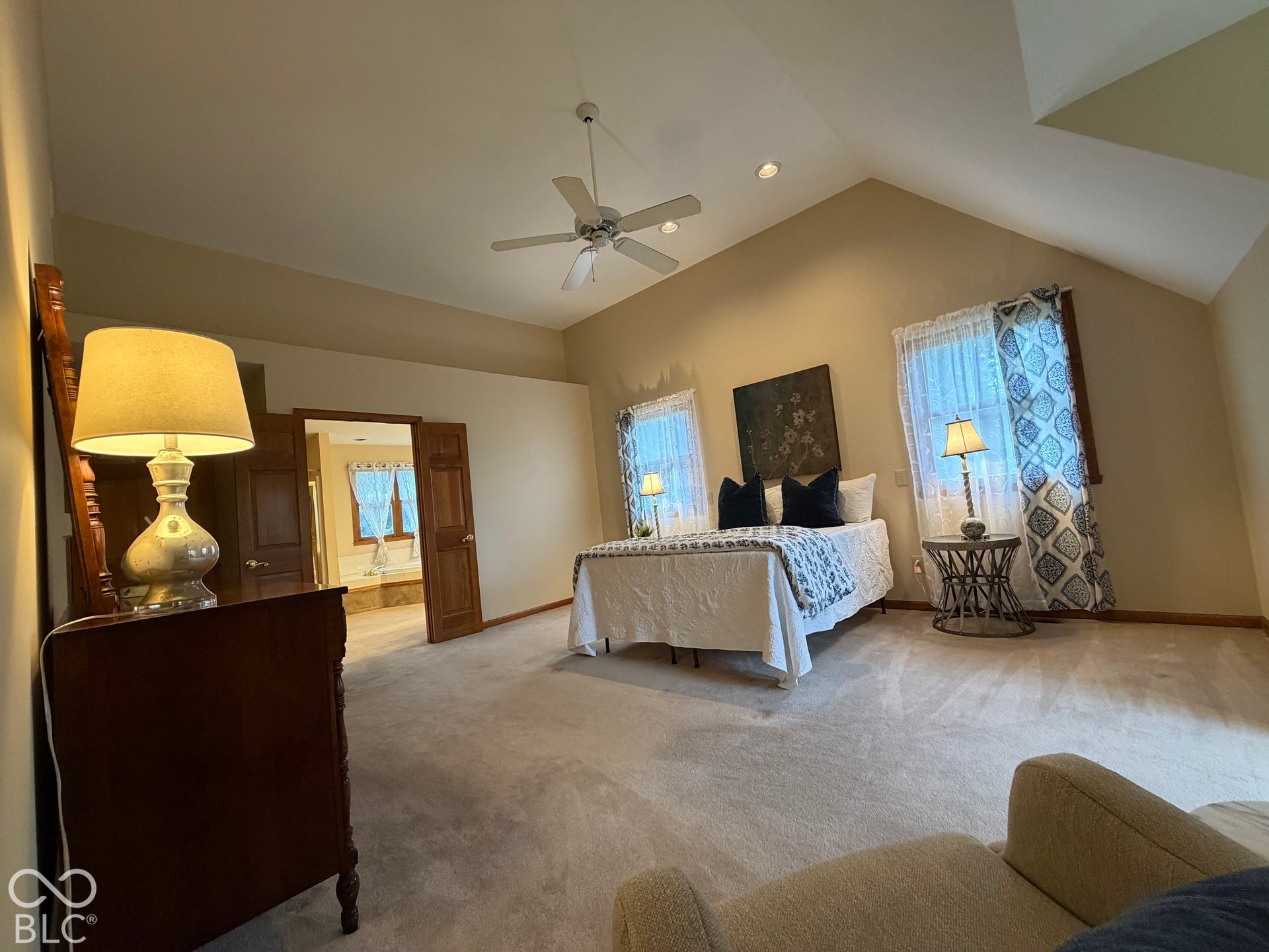 Retreat, relax, rejuvenate in this luxurious primary suite: soaring ceilings, natural light, dormer with window seat, French doors leading to your en-suite with two vanities, makeup counter, true garden tub with jets allows the perfect spa experience