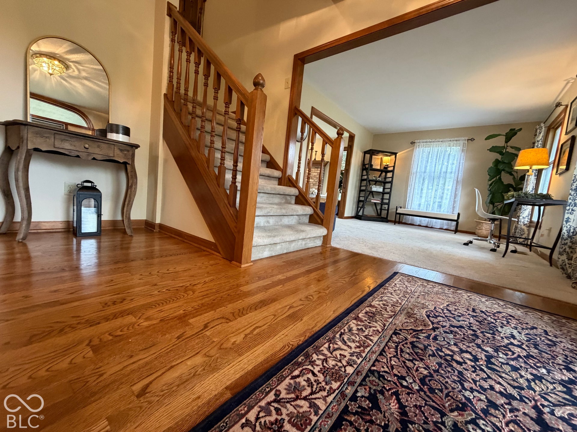 Hardwood floors and wood trim reinforce the quality of this custom built home.