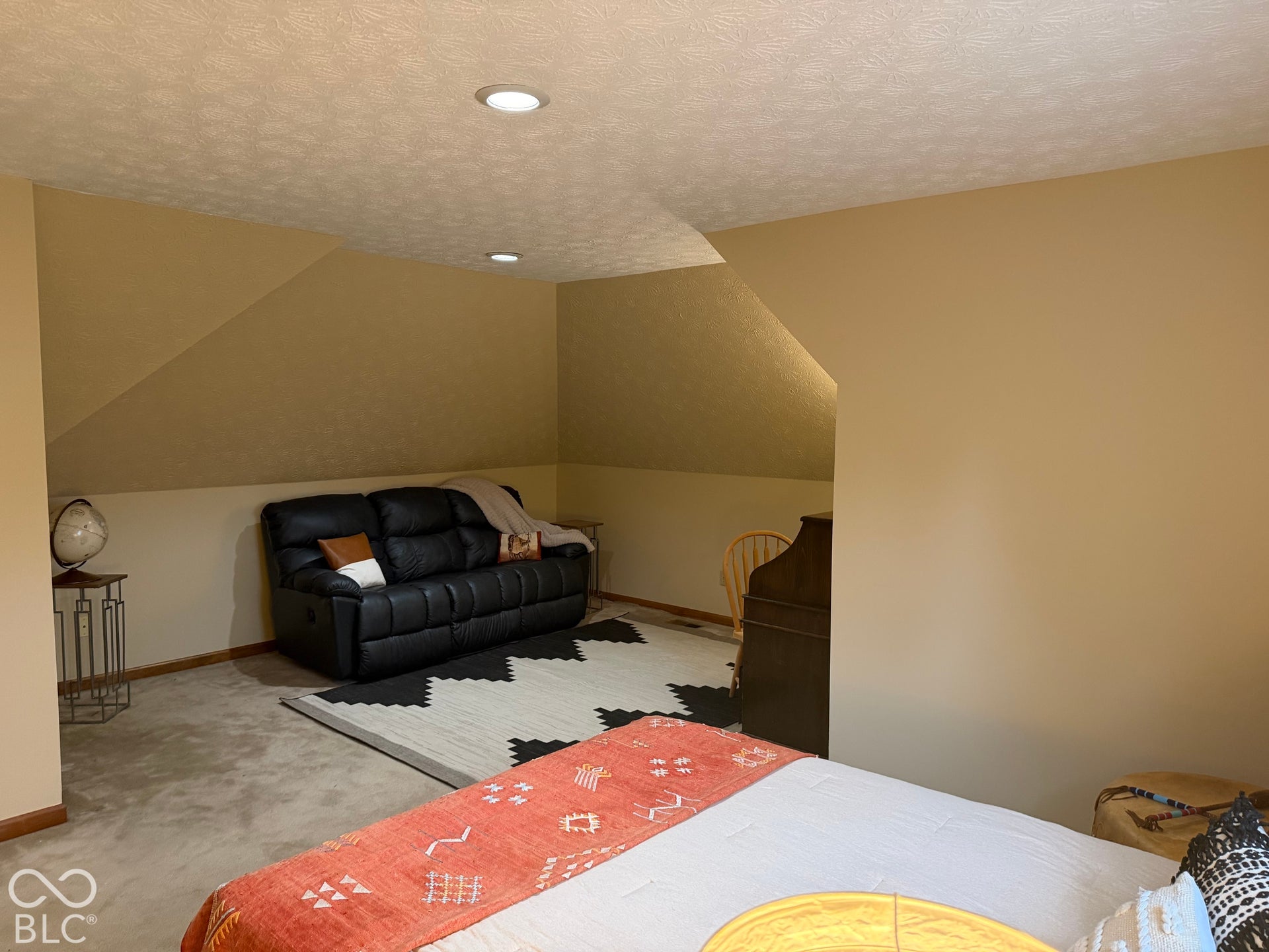 Slanted ceilings, recessed lighting, multiple areas for multi-purpose living, with beautiful sunset views of your lovely landscaped home site.