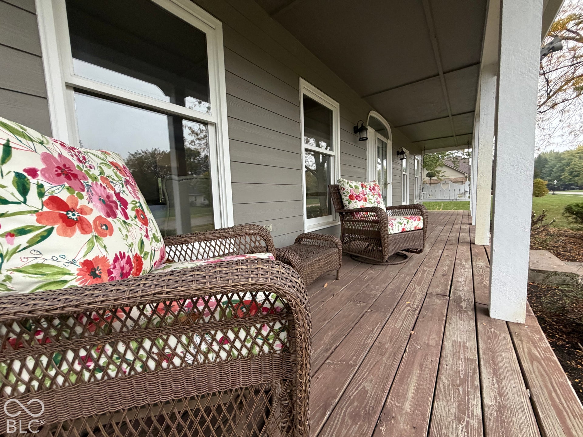 Expansive covered porch is the perfect place to slow down and enjoy your favorite book, drink and friends.