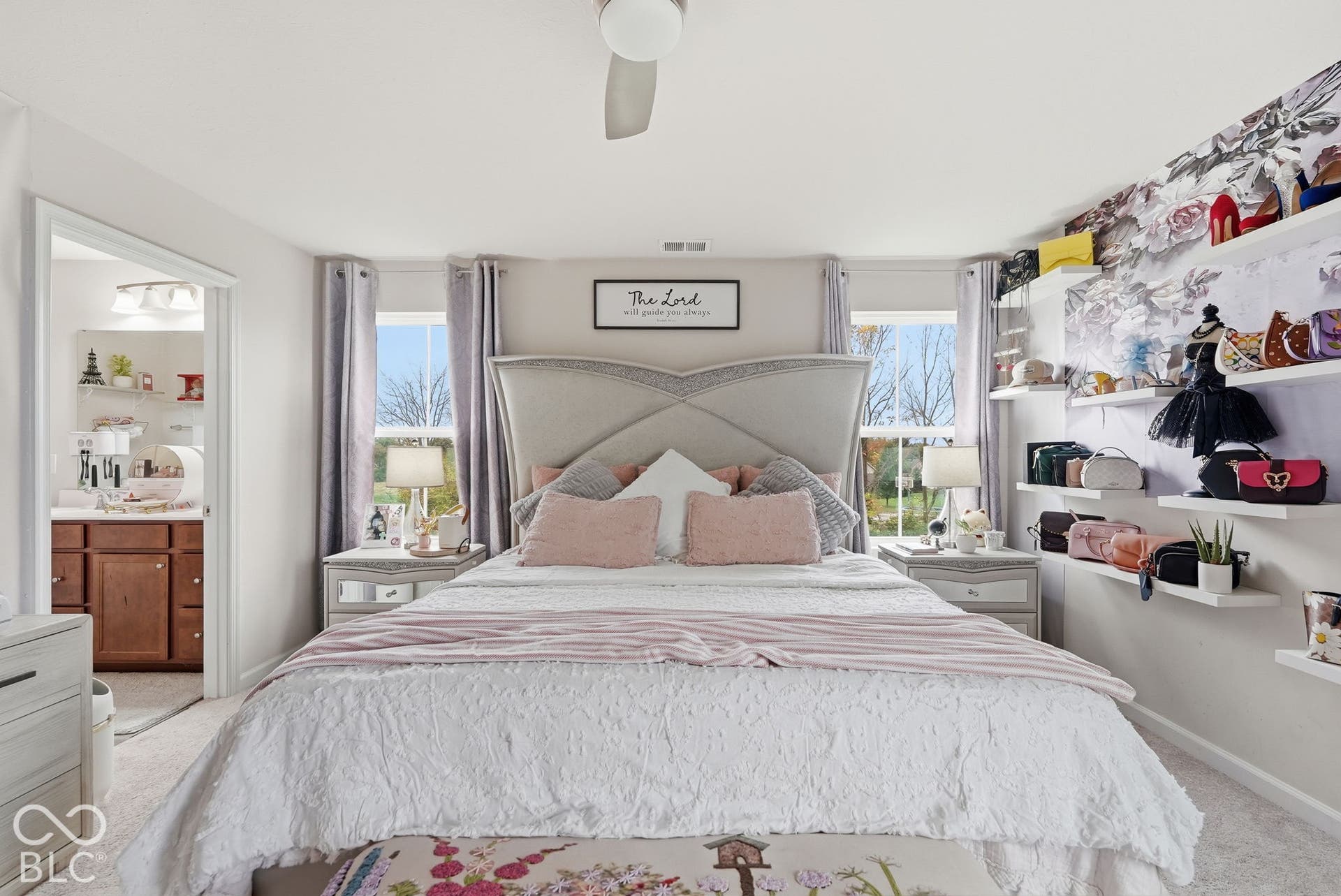 275 Bohicket Road, Whiteland, IN 46184 Bedroom featuring carpeted flooring, dual windows with flanking curtains, a central ceiling fan, and wall-mounted floating shelves