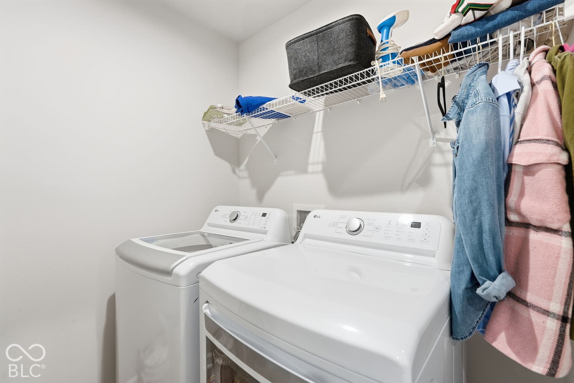 275 Bohicket Road, Whiteland, IN 46184 Utility space featuring top-load washing machine, front-load clothes dryer, and installed wire shelving