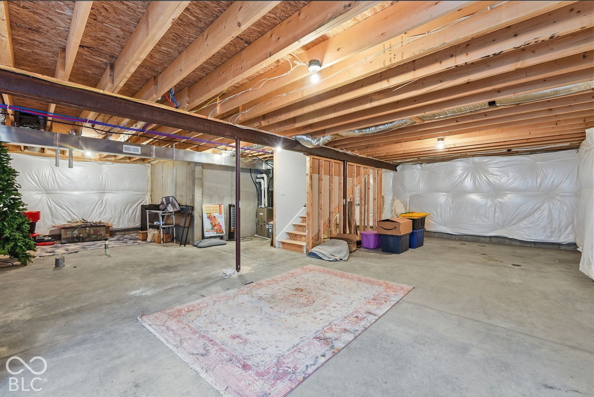 275 Bohicket Road, Whiteland, IN 46184 Unfinished basement area featuring exposed timber ceiling joists, concrete flooring, perimeter vapor barrier insulation, and a central steel support column