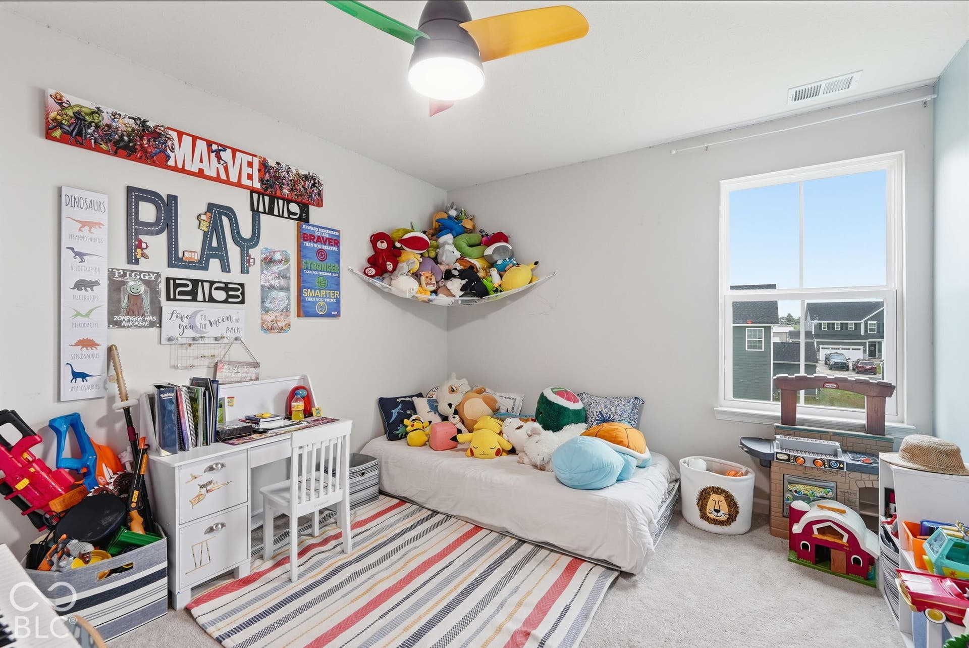 275 Bohicket Road, Whiteland, IN 46184 Neutral-toned room featuring wall-to-wall carpeting, a multi-pane window, and an attached multi-colored ceiling fan