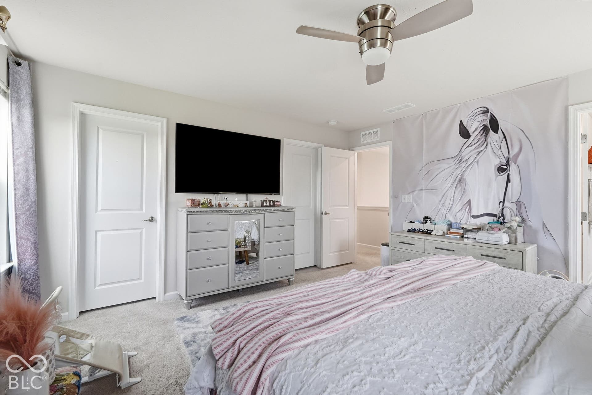 275 Bohicket Road, Whiteland, IN 46184 Neutral-toned interior featuring wall-to-wall carpeting, three-panel interior doors, and a ceiling fan with integrated lighting