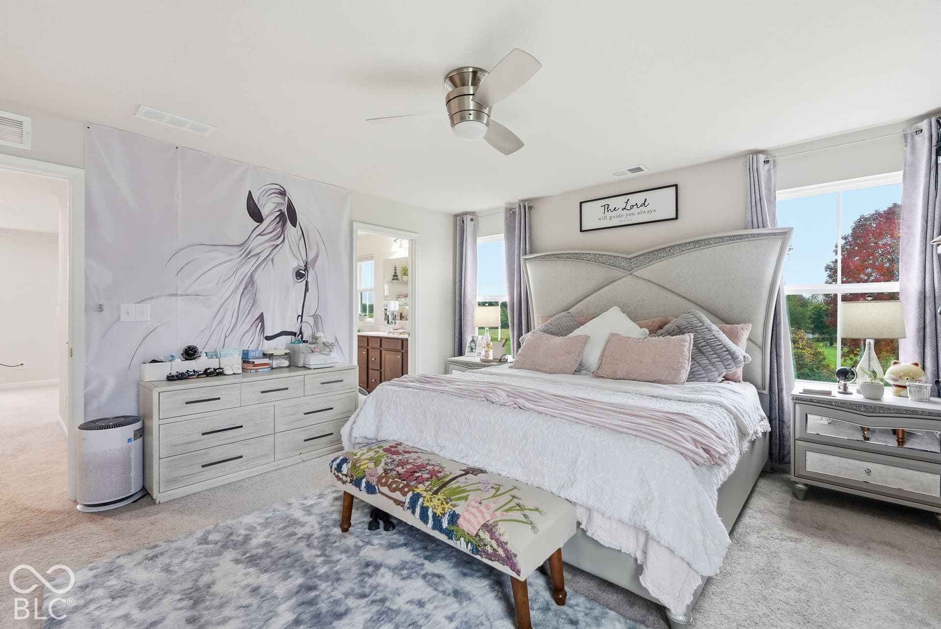 275 Bohicket Road, Whiteland, IN 46184 Spacious bedroom featuring neutral wall-to-wall carpeting, a multi-blade ceiling fan with integrated lighting, and multiple windows