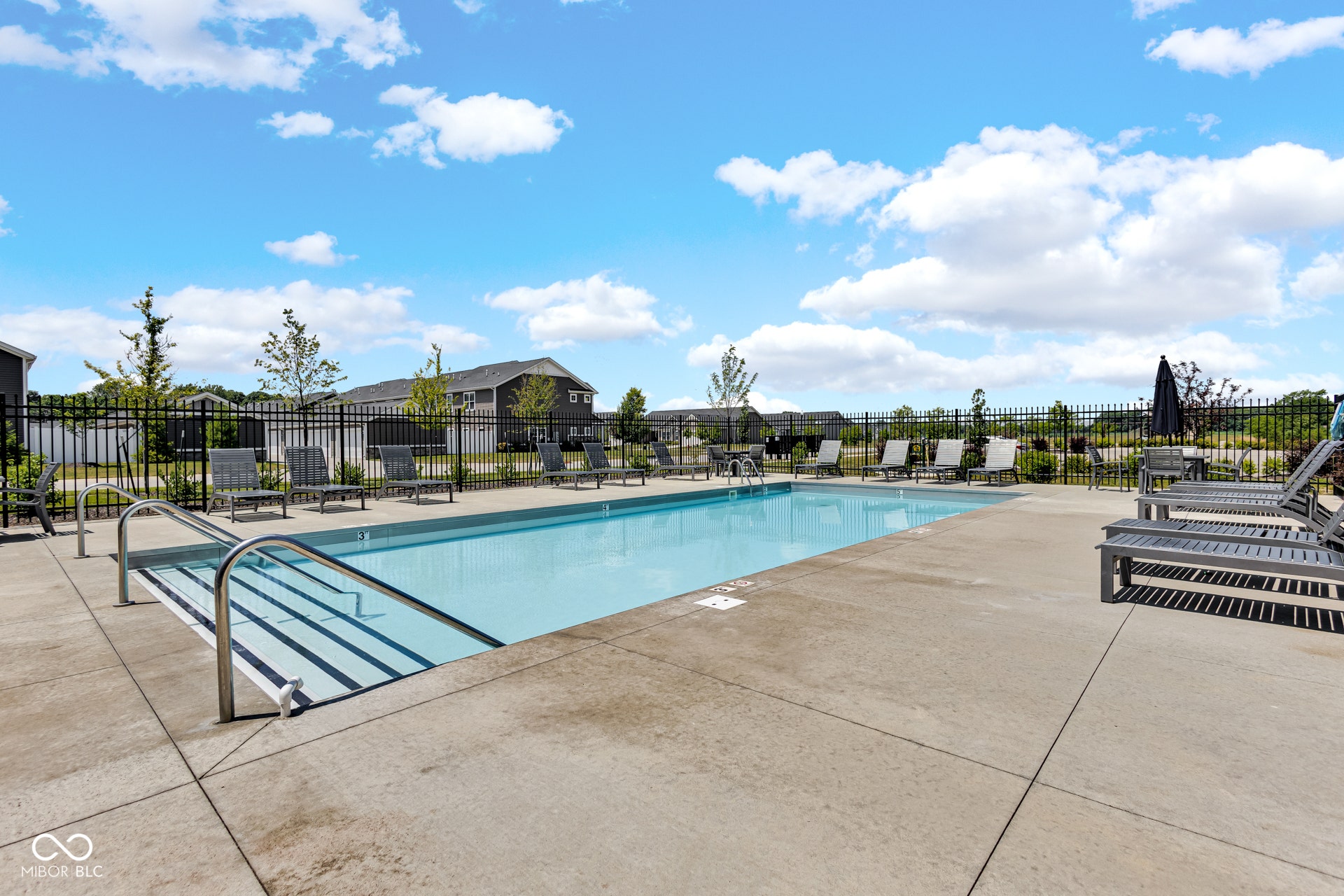 community pool featuring a patio area