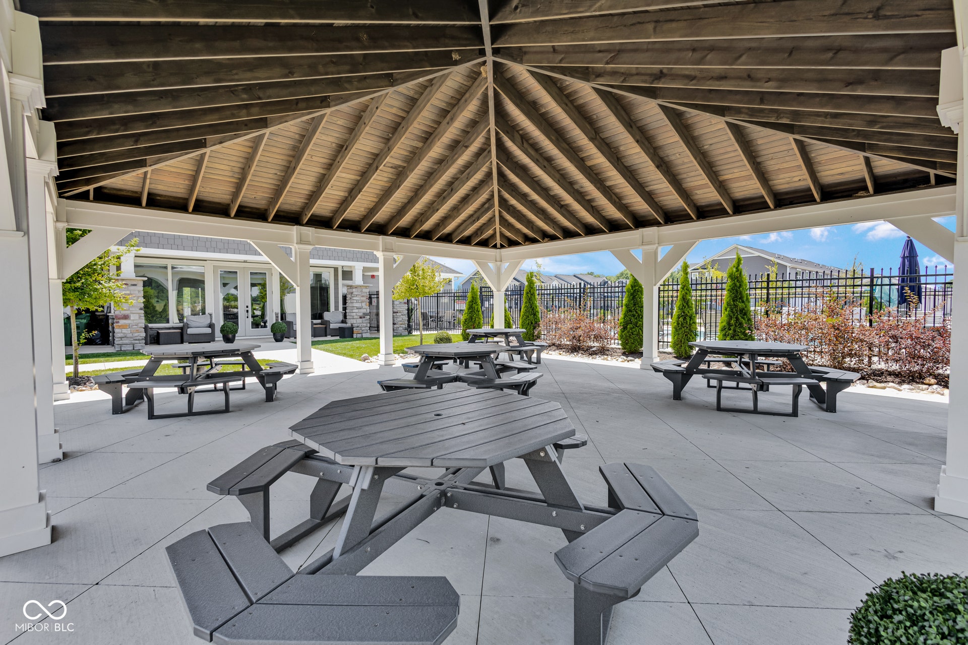 view of home's community featuring a patio area and outdoor dining area
