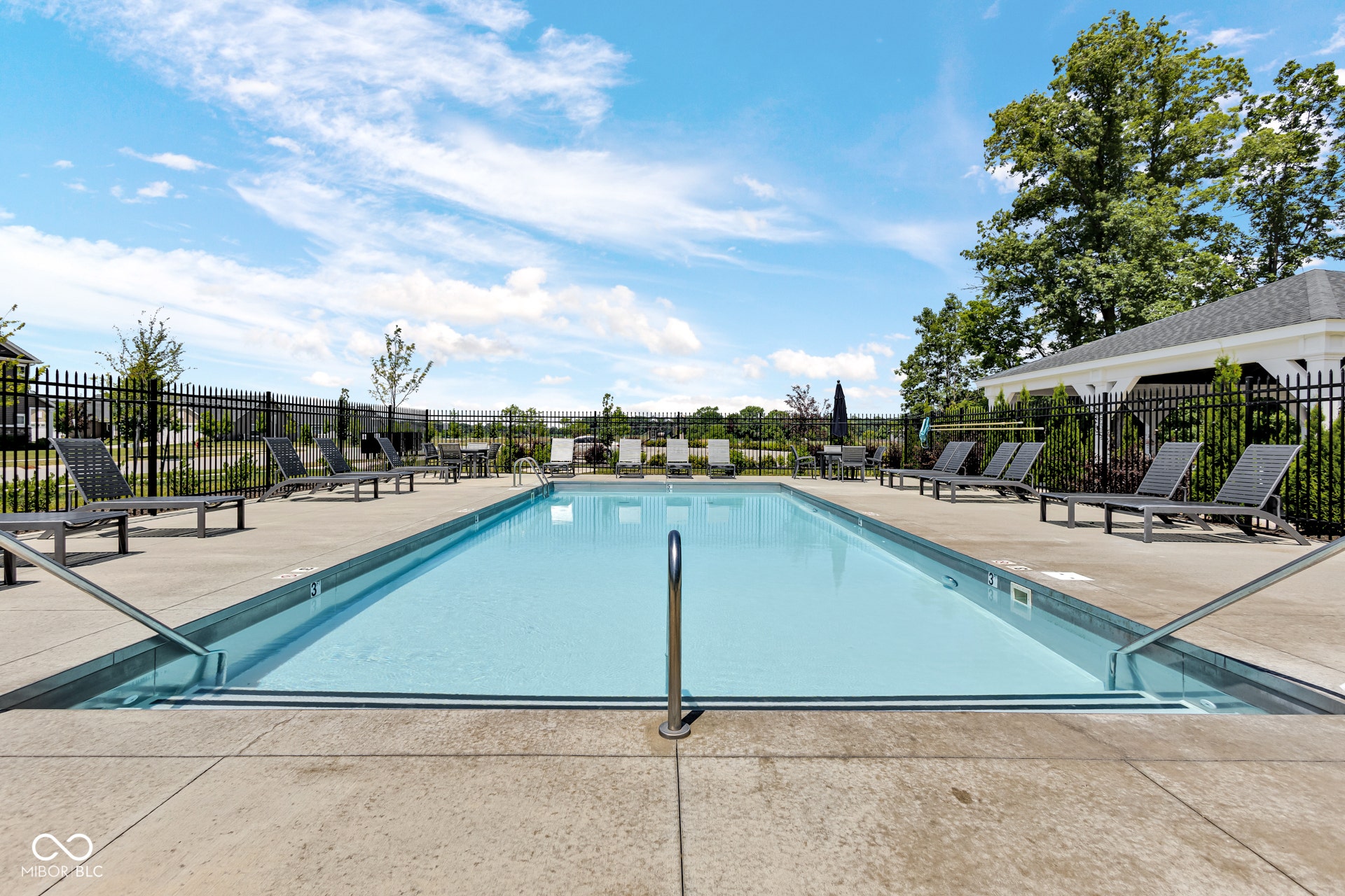 community pool with a patio area