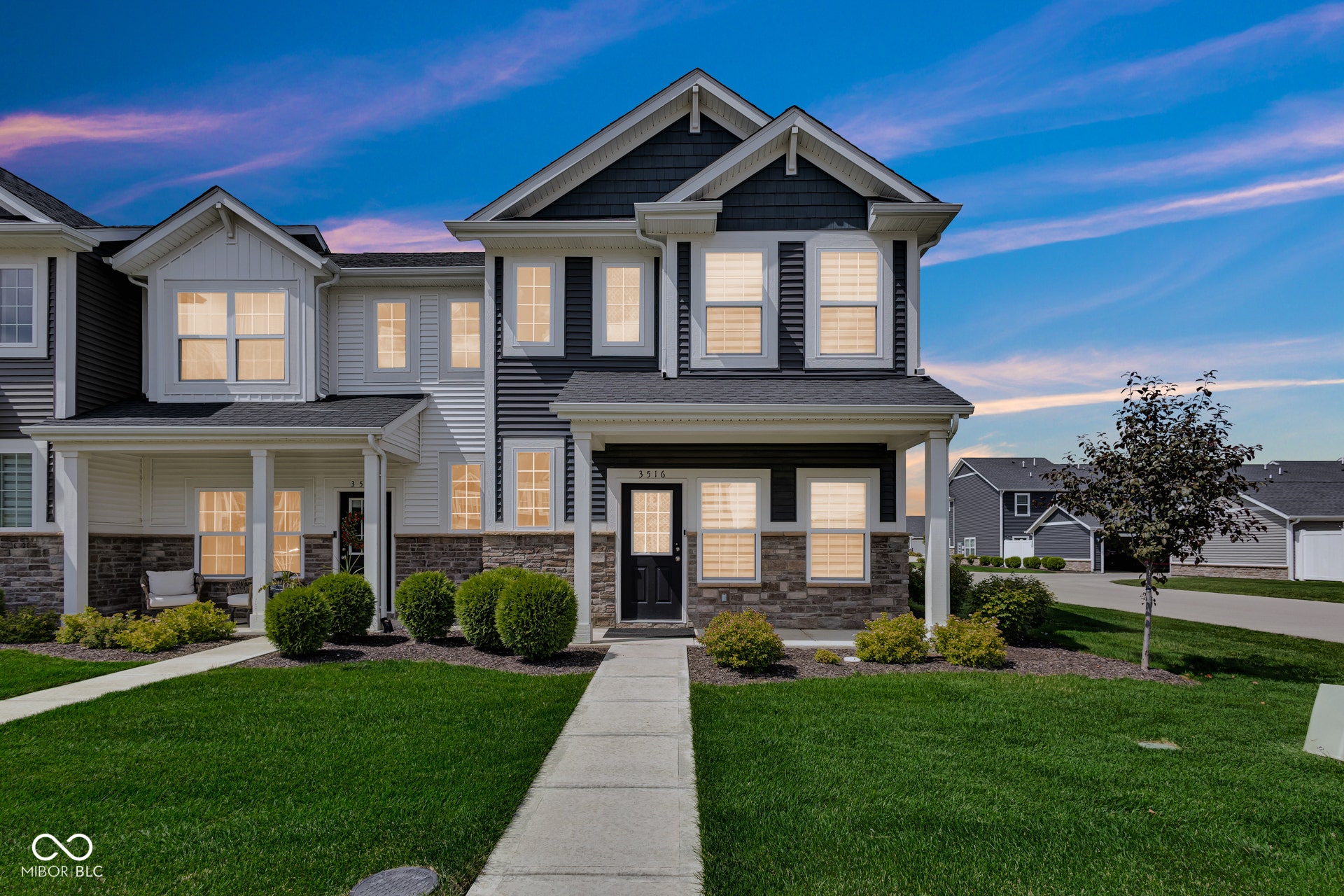 Virtually Altered - craftsman-style house with a porch, a front yard, and stone siding