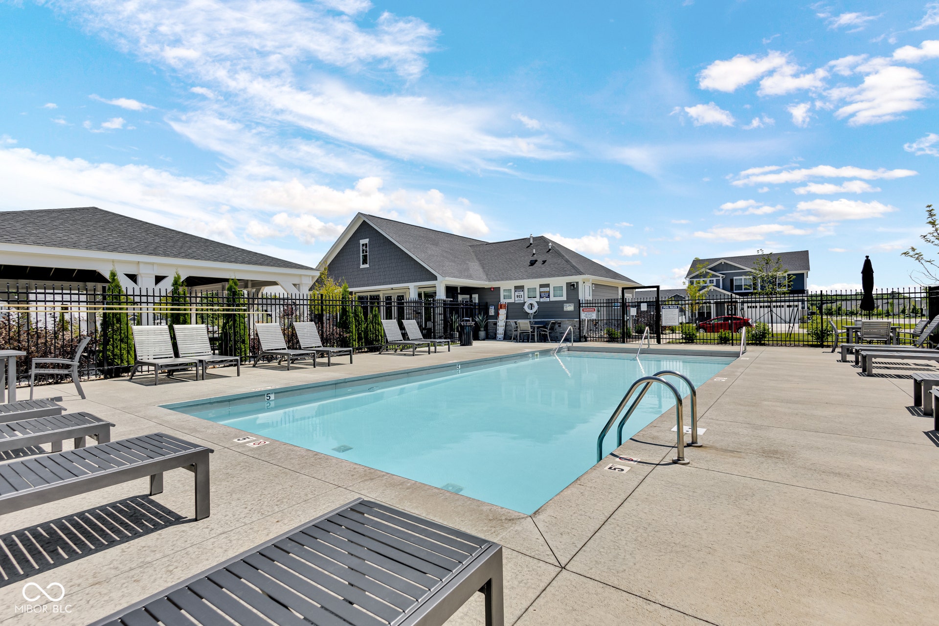 community pool featuring a patio area