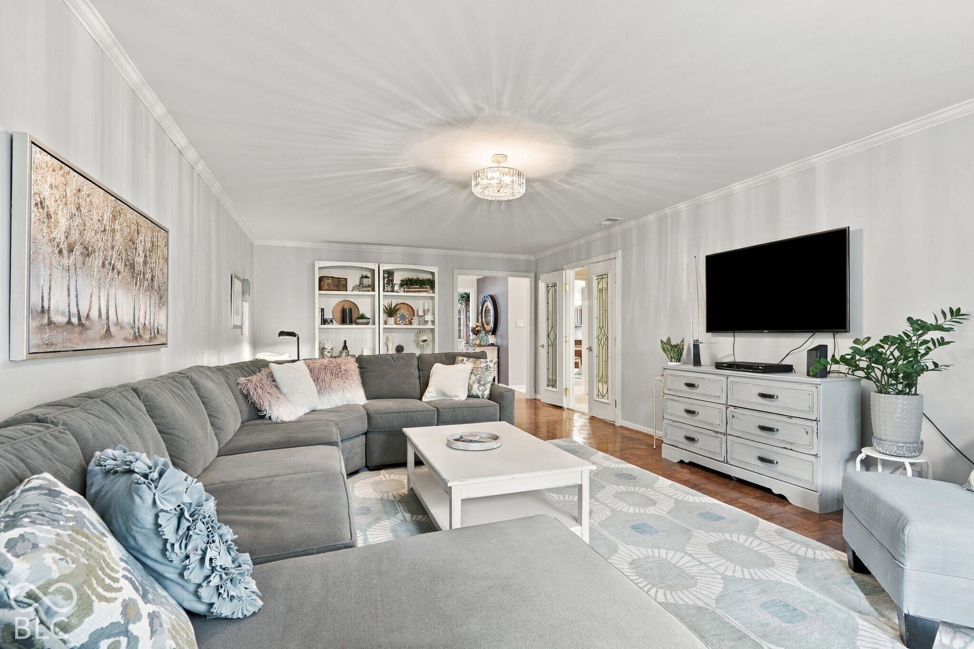 Hues of blue and light grey make this space into something relaxing after a long day.
