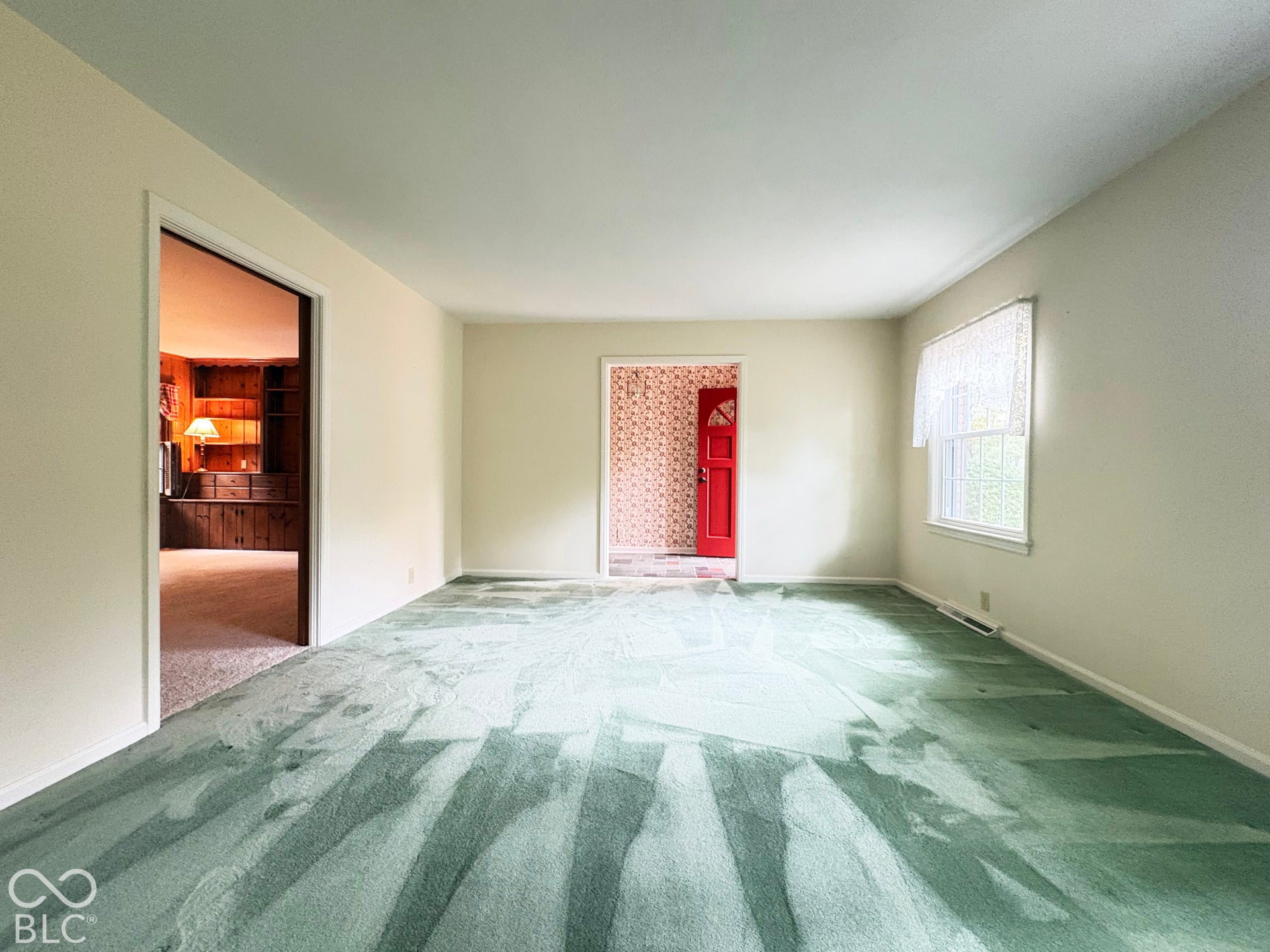 Large 17' x 13' living or dining room as you enter home.  There is hardwood floor under the carpet.