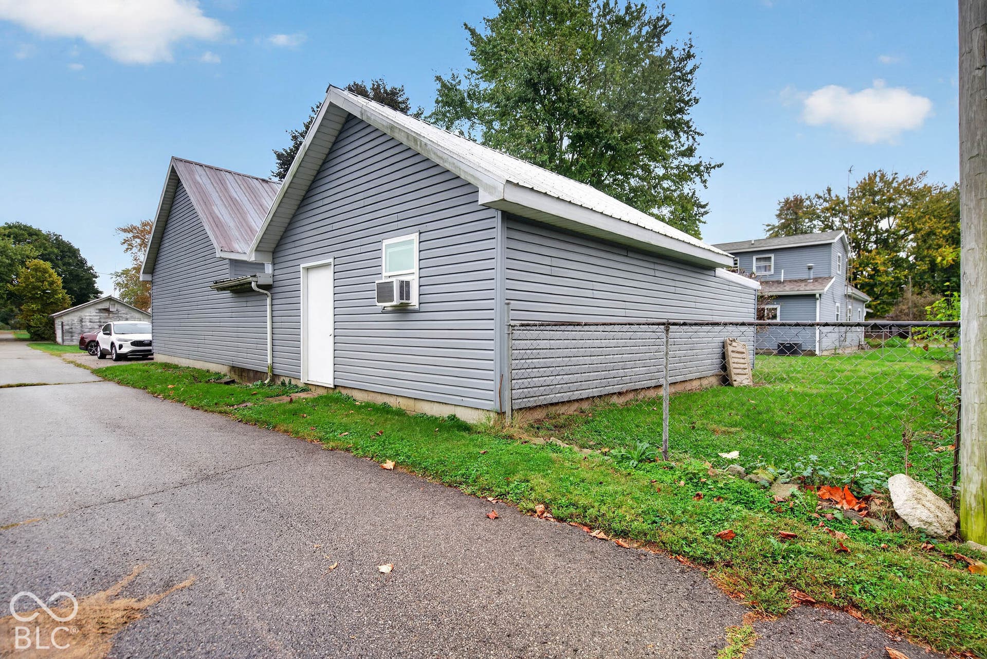 Detached garage includes finished work space or apartment with furnace and half bath.