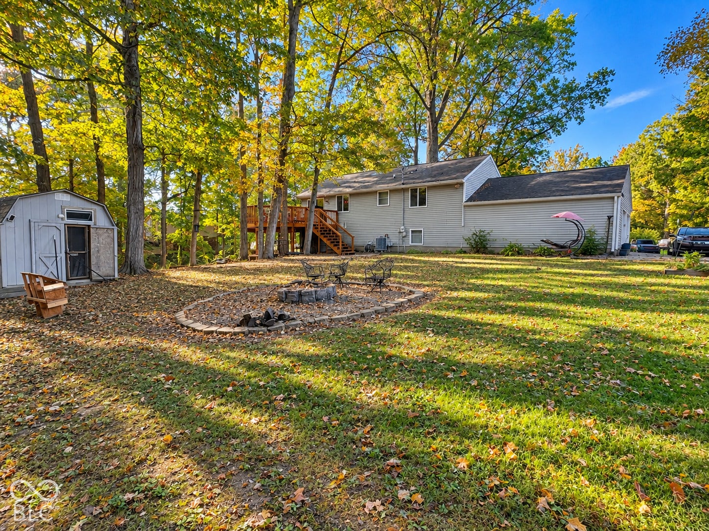 Yard features plenty of room for play and entertaining plus mini barn and large outbuilding for extra storage