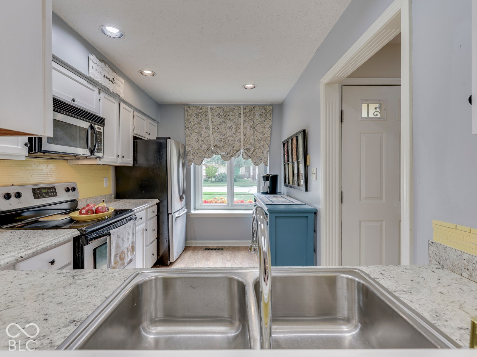 770 Ivy Lane, Greenwood, IN 46143 Kitchen featuring white cabinetry, stone-finish countertops, stainless steel dual-basin undermount sink, and recessed lighting