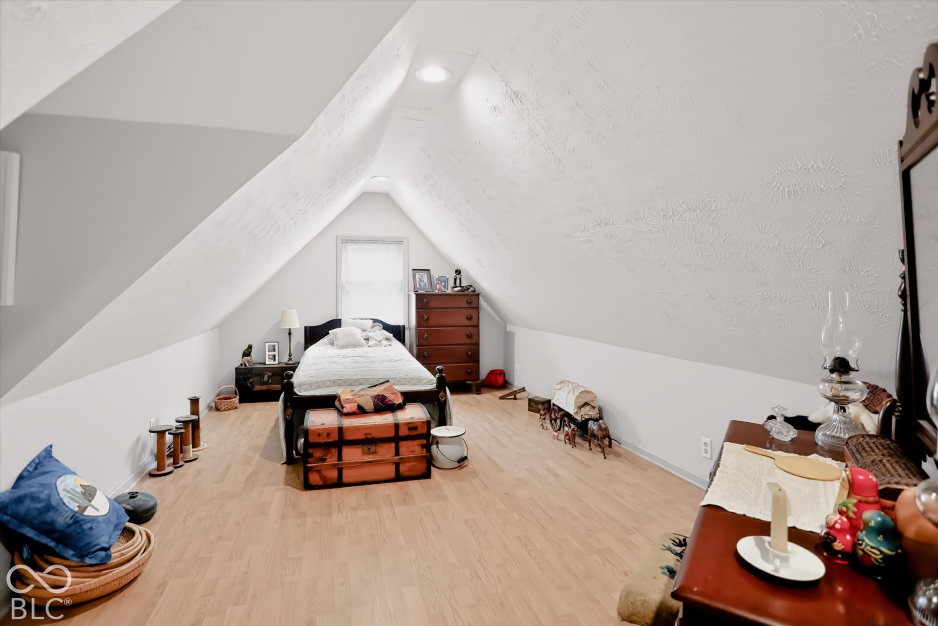 304 W 4th Street, Greenfield, IN 46140 Vaulted ceiling with angled walls, recessed lighting, and wood-finish flooring