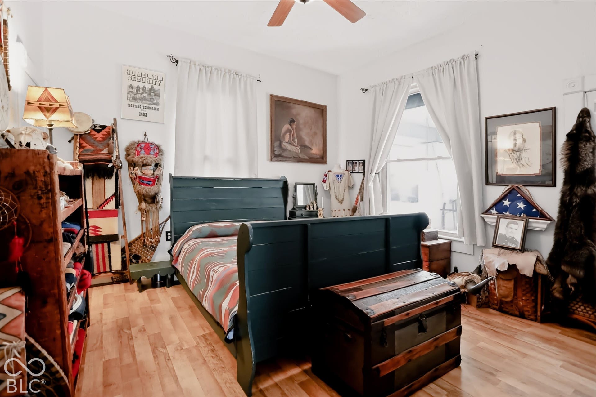 304 W 4th Street, Greenfield, IN 46140 Room featuring wood-finish flooring, dual windows with curtains, and a ceiling fan