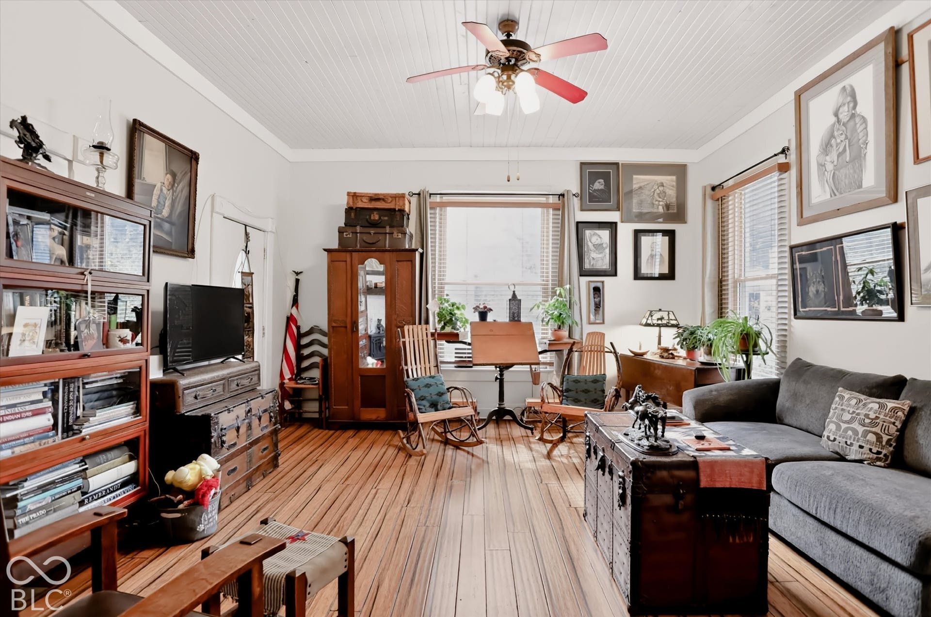 304 W 4th Street, Greenfield, IN 46140 Living space featuring vertical beadboard ceiling, wood-finish flooring, and a ceiling-mounted light fixture with a fan