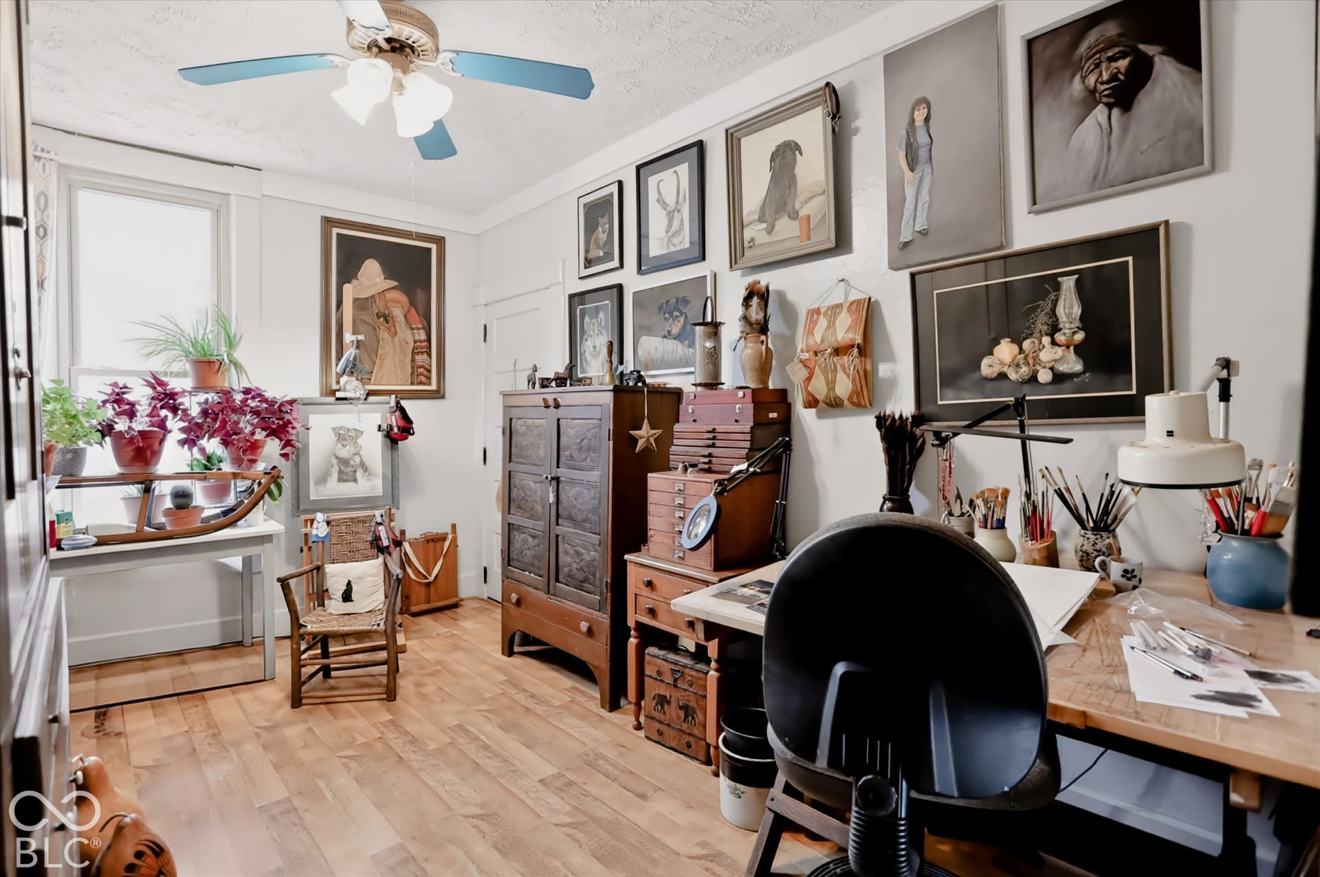 304 W 4th Street, Greenfield, IN 46140 Interior room featuring wood-finish flooring, white walls, a dual-pane window, and a ceiling-mounted light fixture with a fan