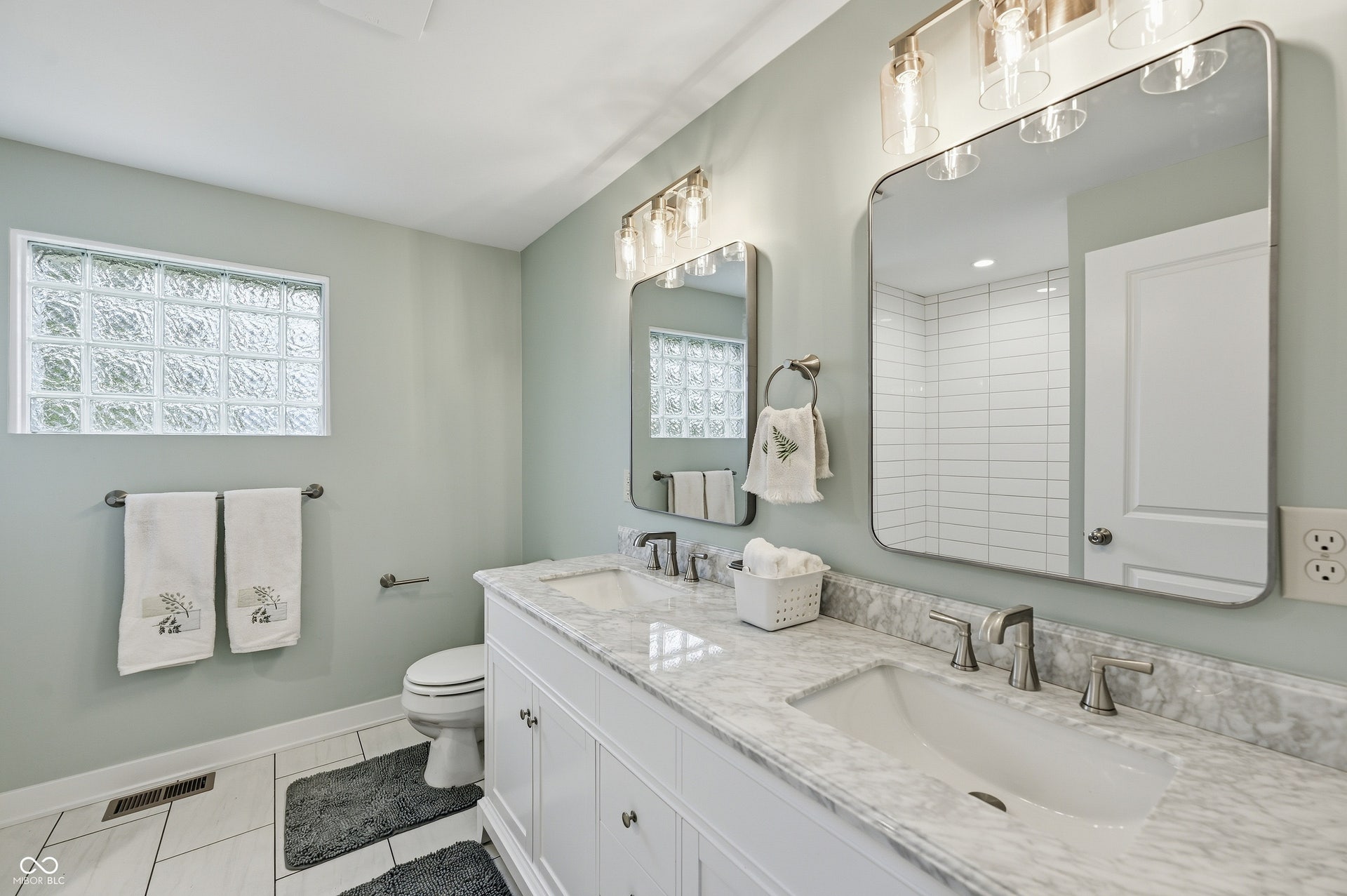 Dual vanity with stone countertop and undermount sinks