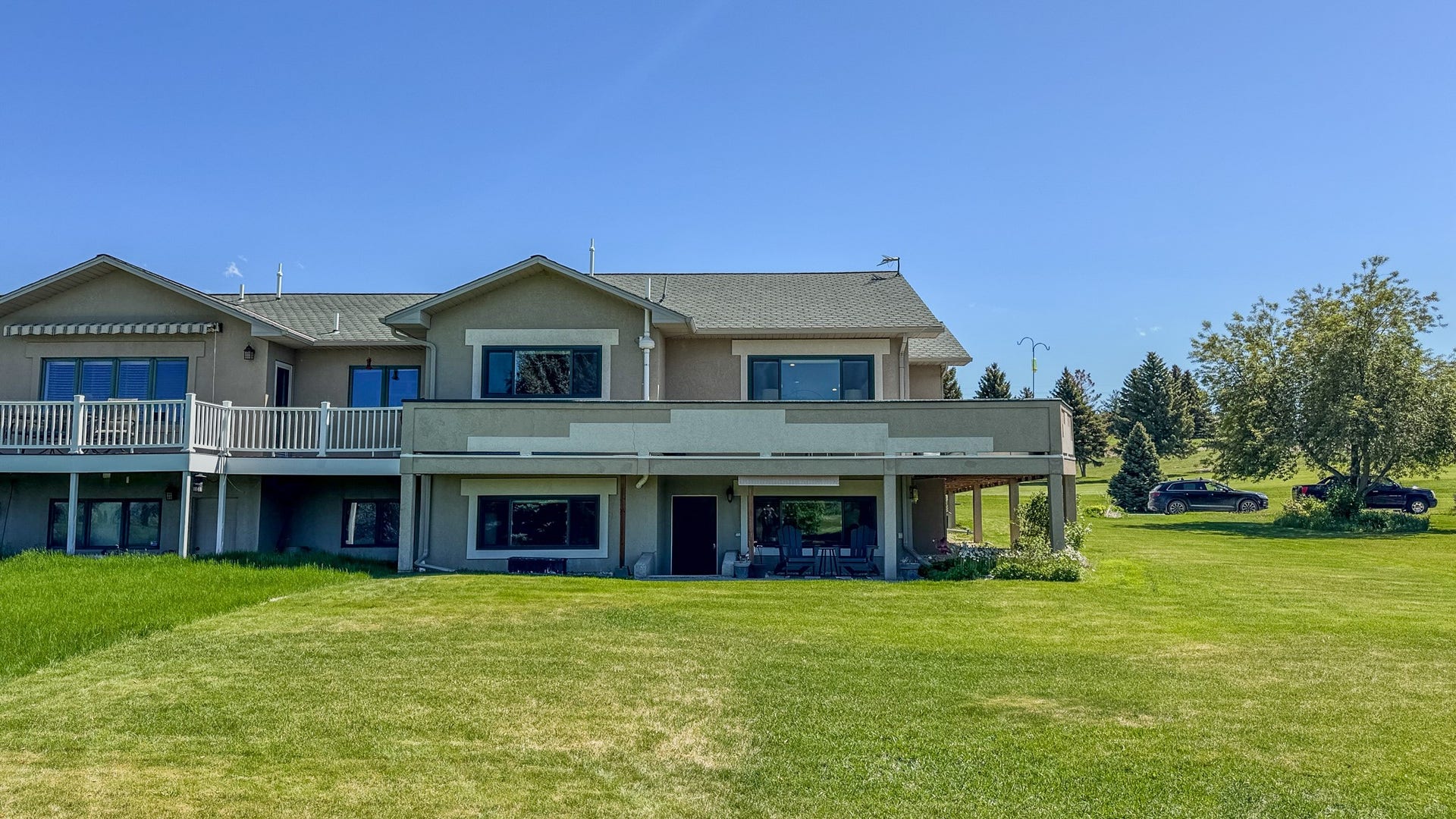 4134 Fox Ridge Drive, Helena, MT 59602 Townhome / multi-family property with a front yard, stucco siding, and a wooden deck