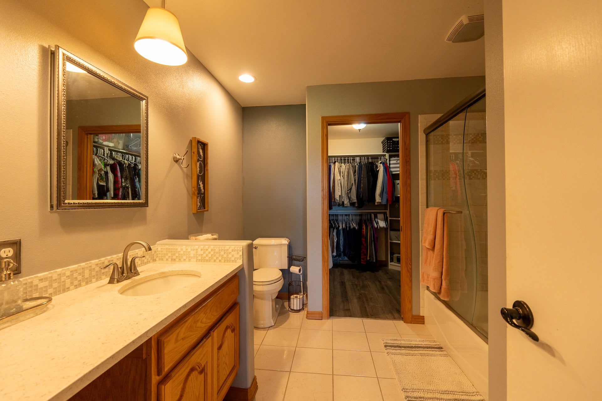 4134 Fox Ridge Drive, Helena, MT 59602 Bathroom featuring toilet, vanity, tile patterned floors, and a walk in closet
