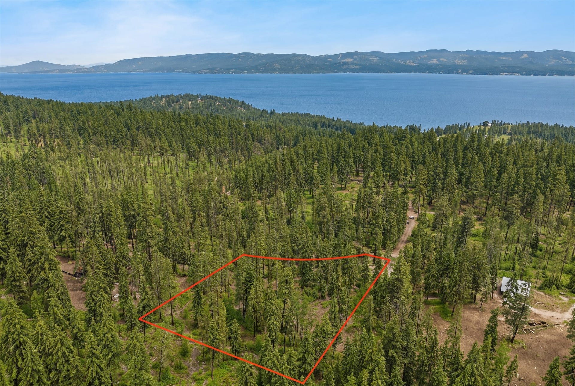 375 Ranch Road, Bigfork, MT 59911 AI-generated seasonal visualization; original photo immediately following