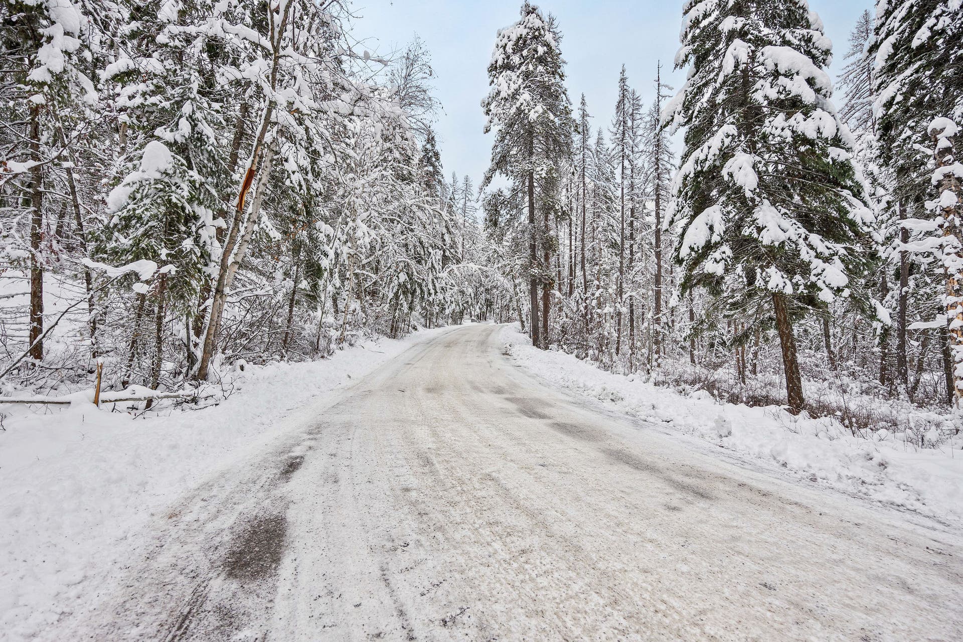 375 Ranch Road, Bigfork, MT 59911 Drone view showing the maintained access road in the winter