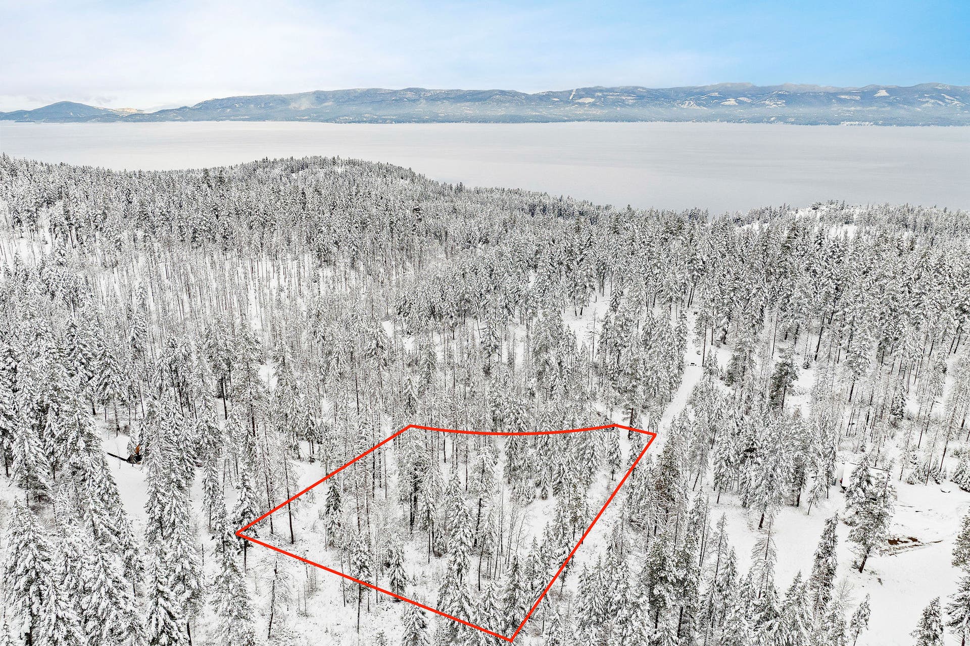 375 Ranch Road, Bigfork, MT 59911 Stunning vista view of Flathead Lake with the lot boundaries outlined in red