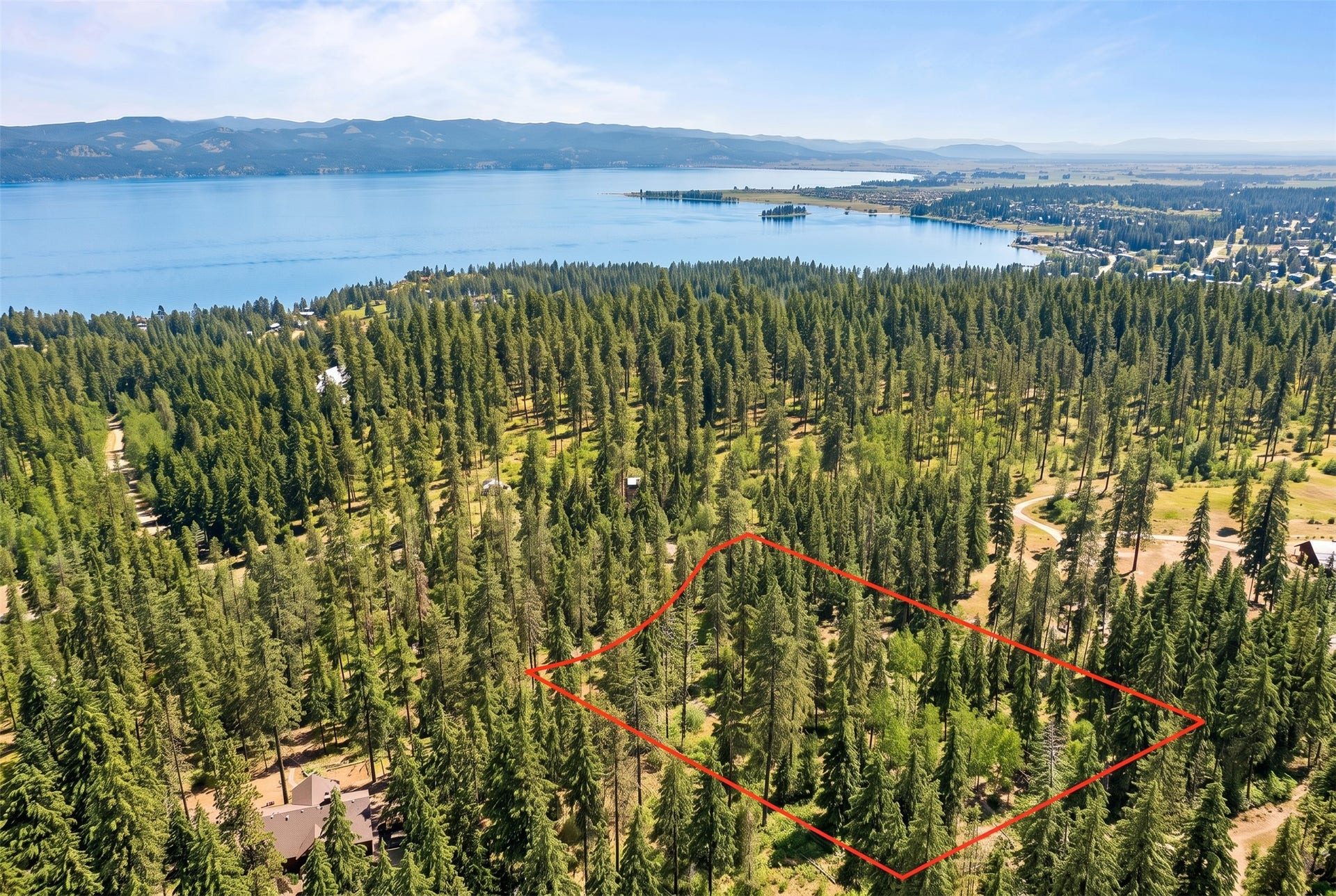 375 Ranch Road, Bigfork, MT 59911 AI-generated seasonal visualization; original photo immediately following