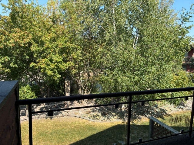 68 Bay Harbor Drive, Bigfork, MT 59911 View from bedroom 2 balcony overlooking water feature